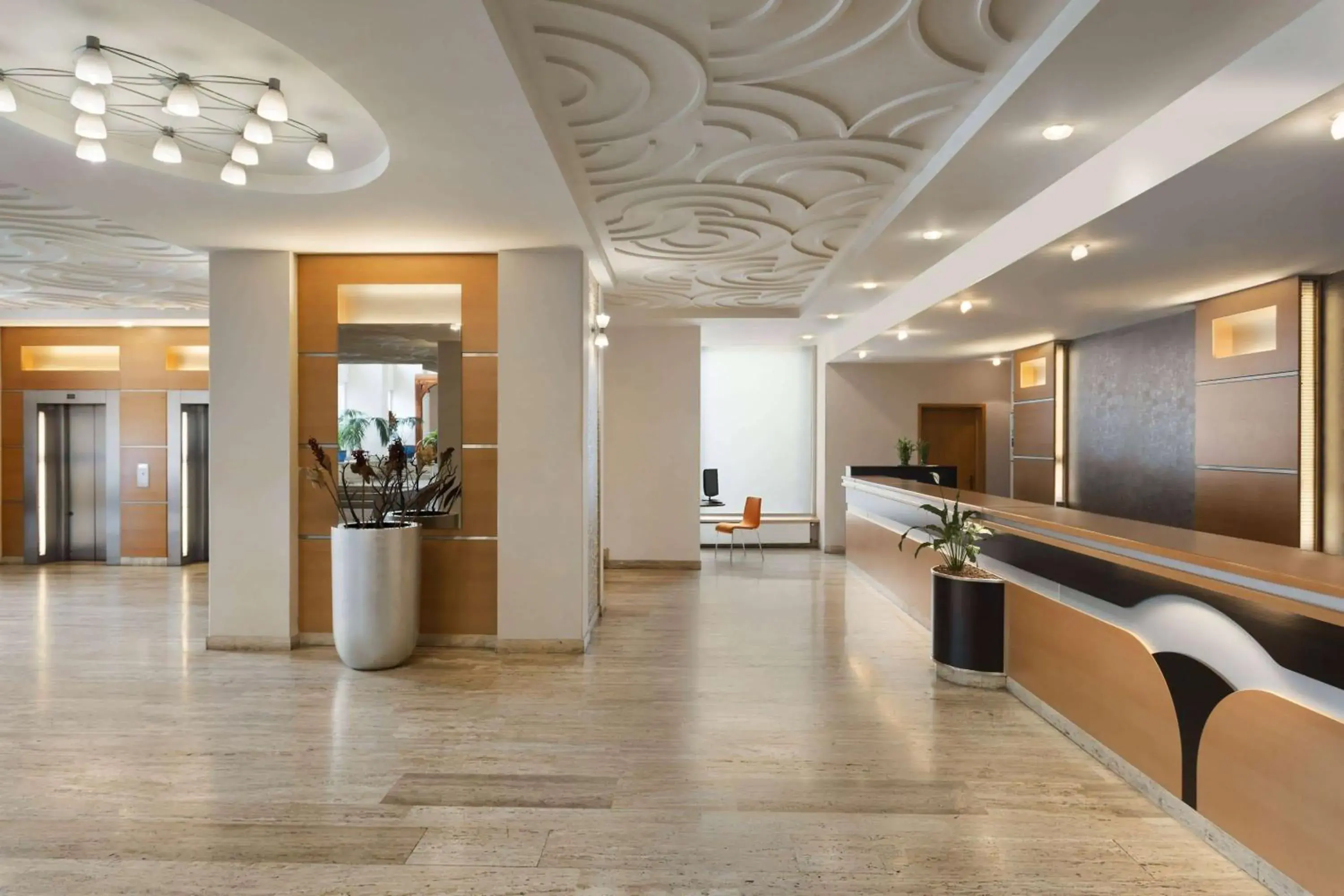 Lobby or reception in Ramada by Wyndham Bucharest Parc Hotel Lobby or reception in Ramada by Wyndham Bucharest Parc Hotel