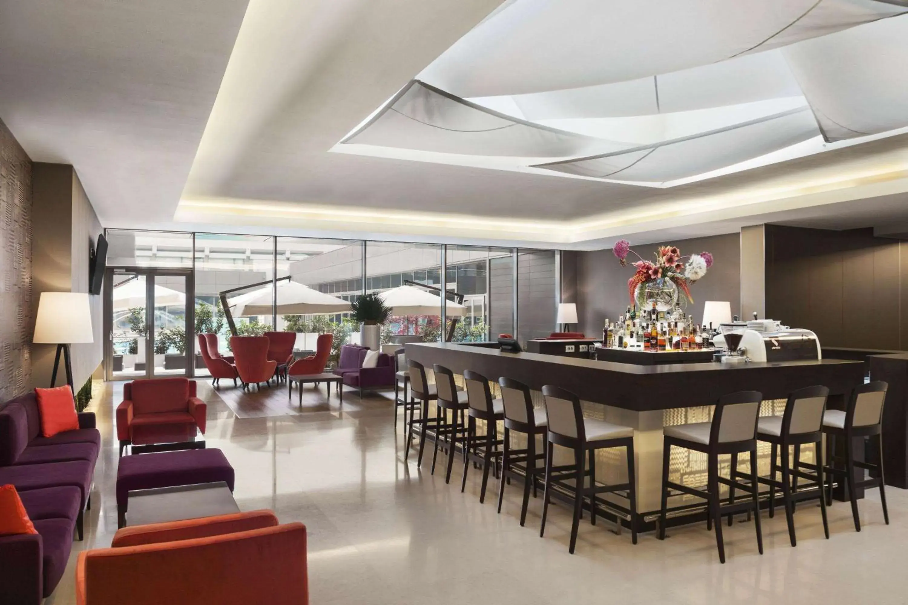 Lounge or bar in Ramada by Wyndham Bucharest Parc Hotel Lounge or bar in Ramada by Wyndham Bucharest Parc Hotel