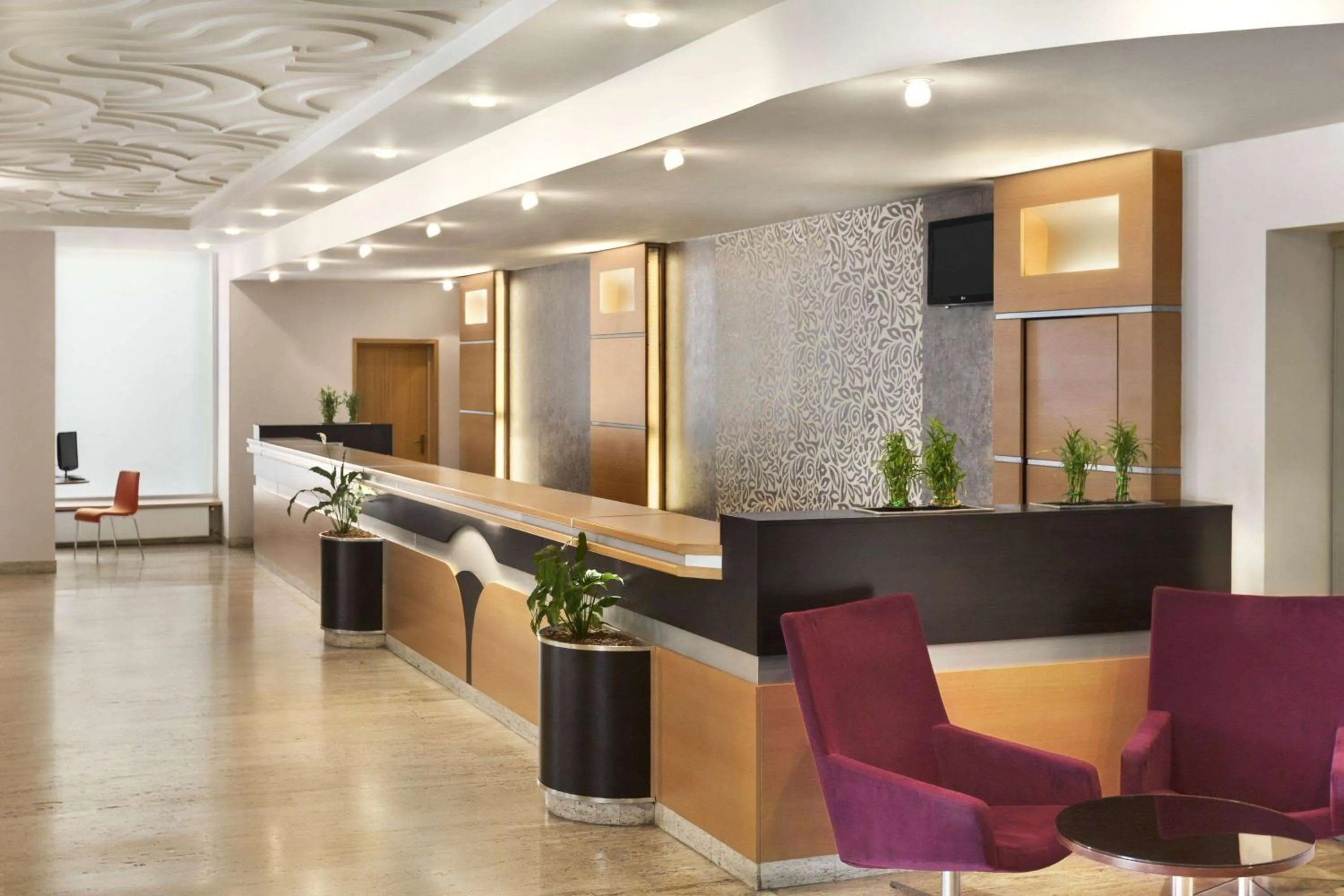 Lobby or reception in Ramada by Wyndham Bucharest Parc Hotel