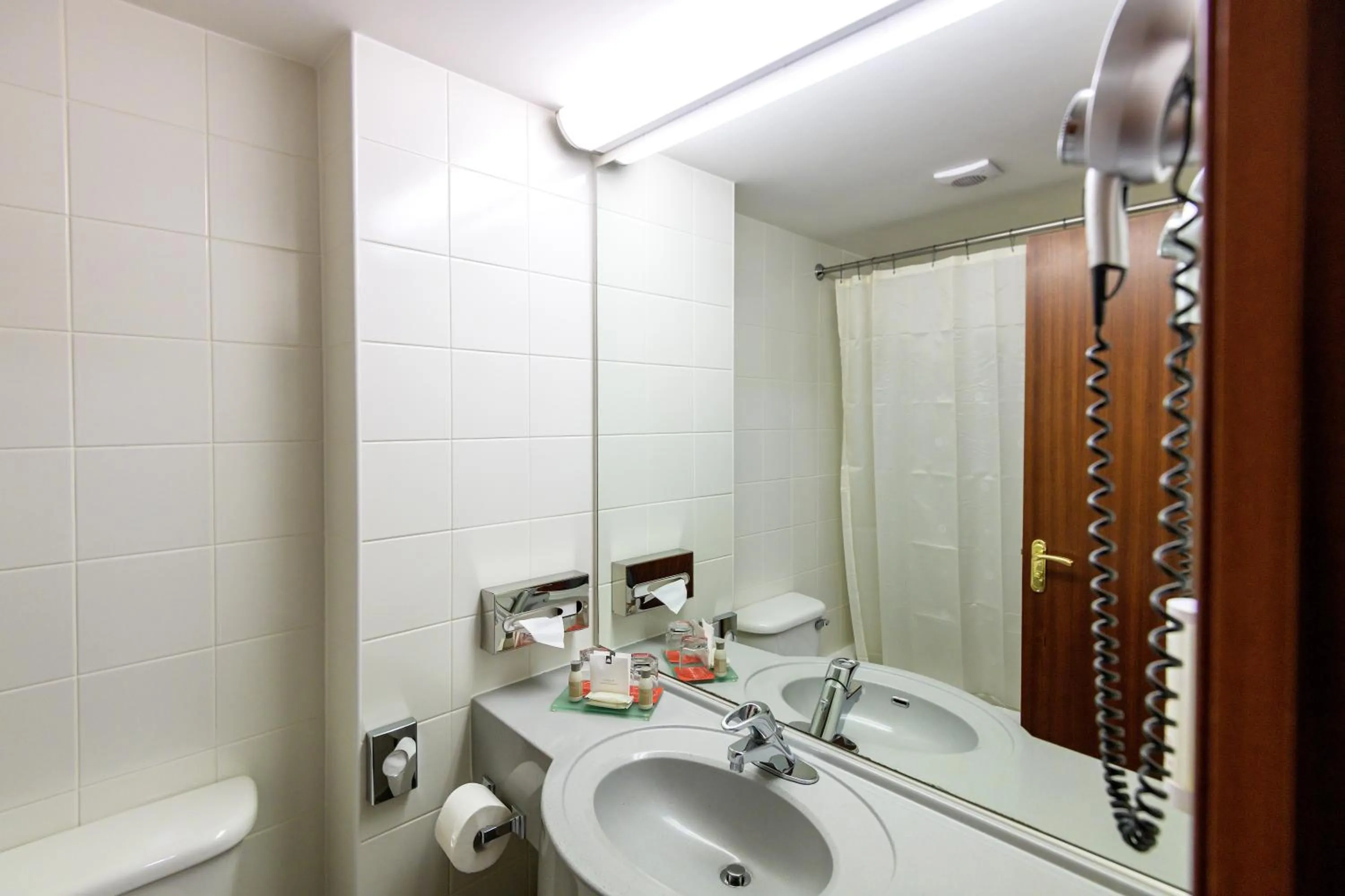 Bathroom in Ramada by Wyndham Bucharest Parc Hotel