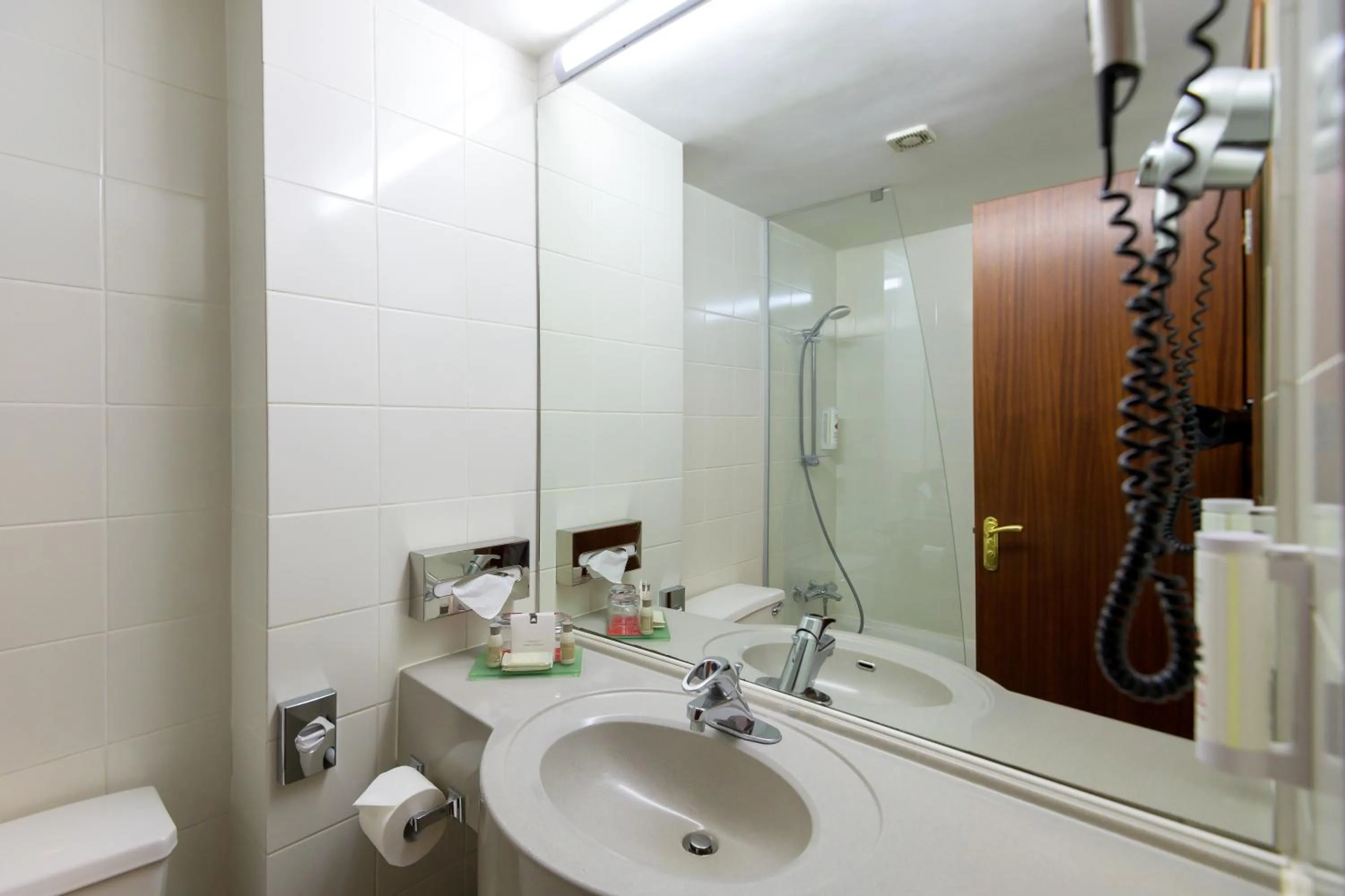 Bathroom in Ramada by Wyndham Bucharest Parc Hotel