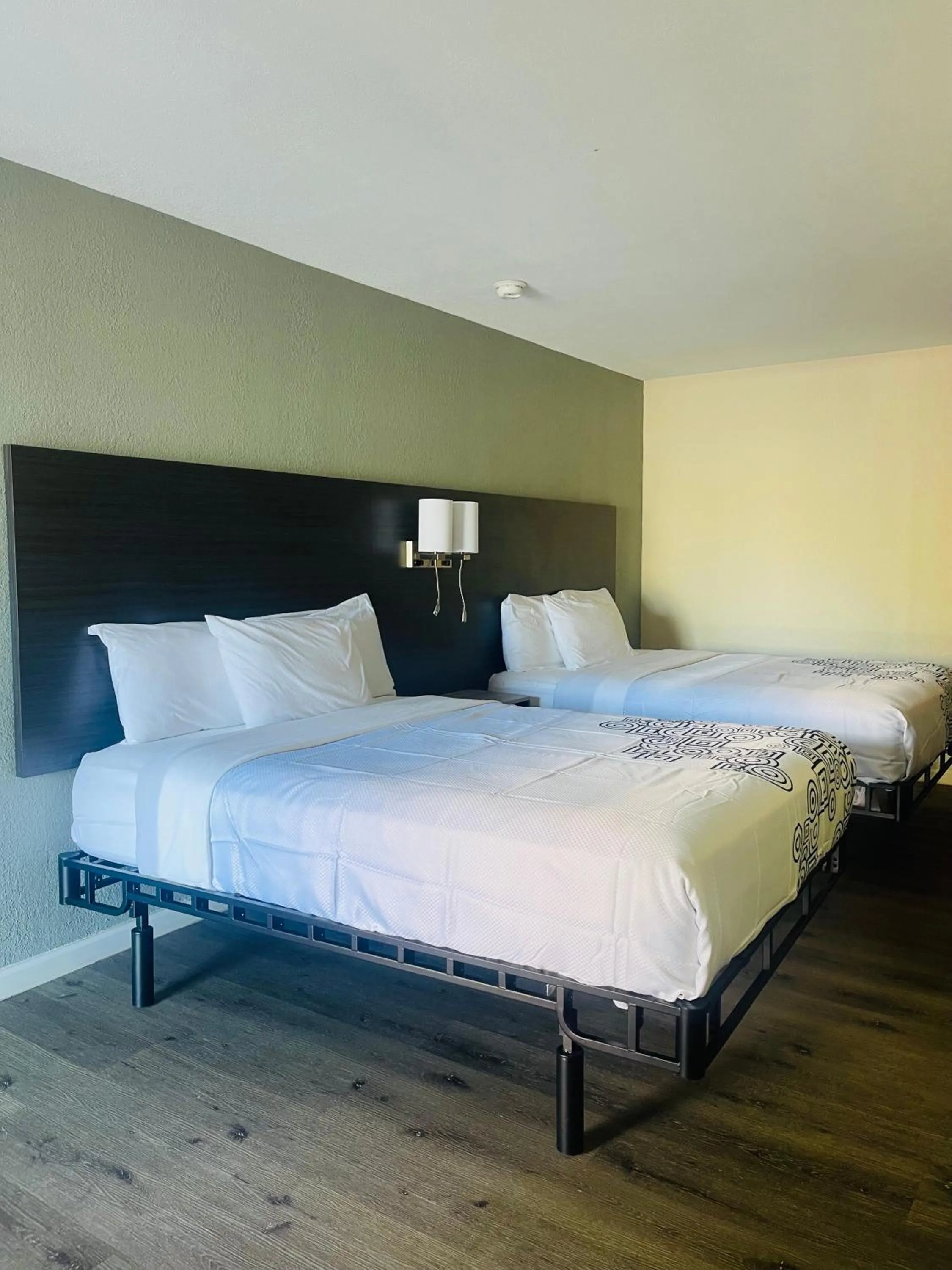 Bed in Bourbon Capital Inn