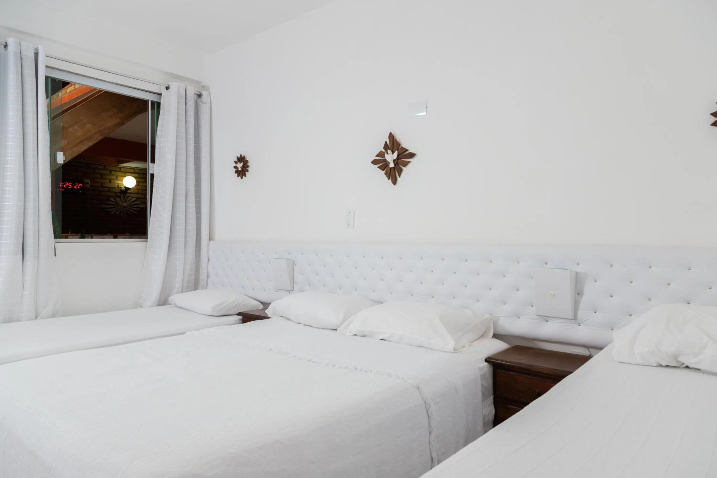 Bed in Pousada Brilho da Serra