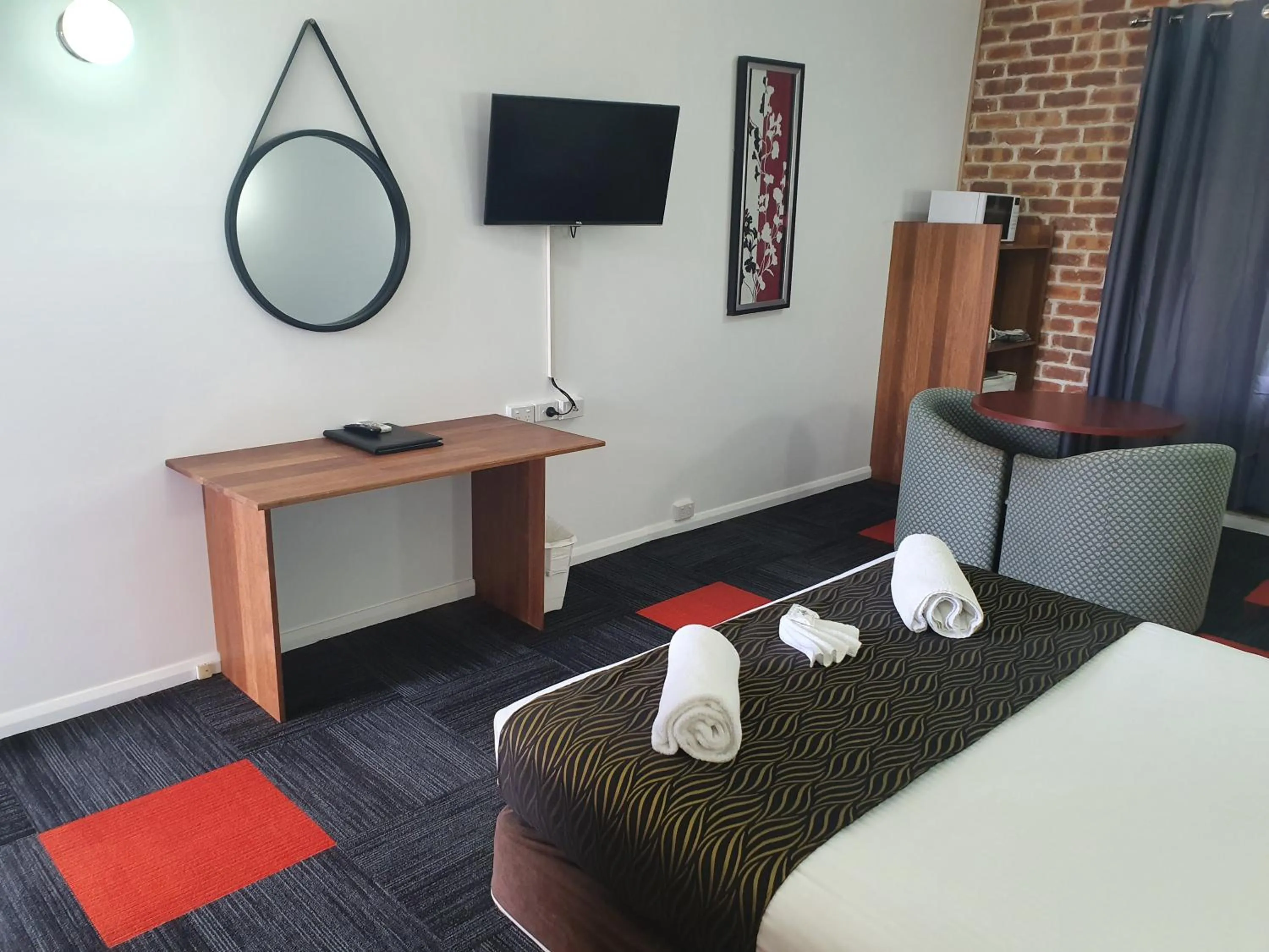 Bed in Moonraker Motor Inn