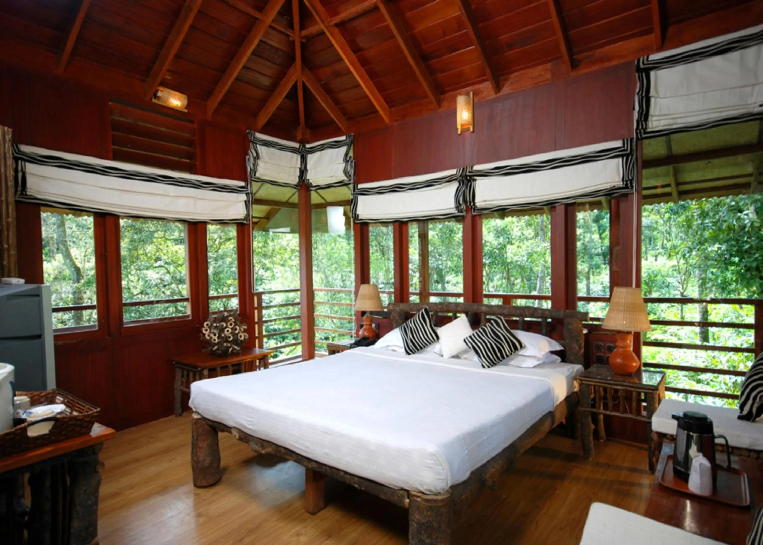 Bed in Carmelia Haven Resort Thekkady