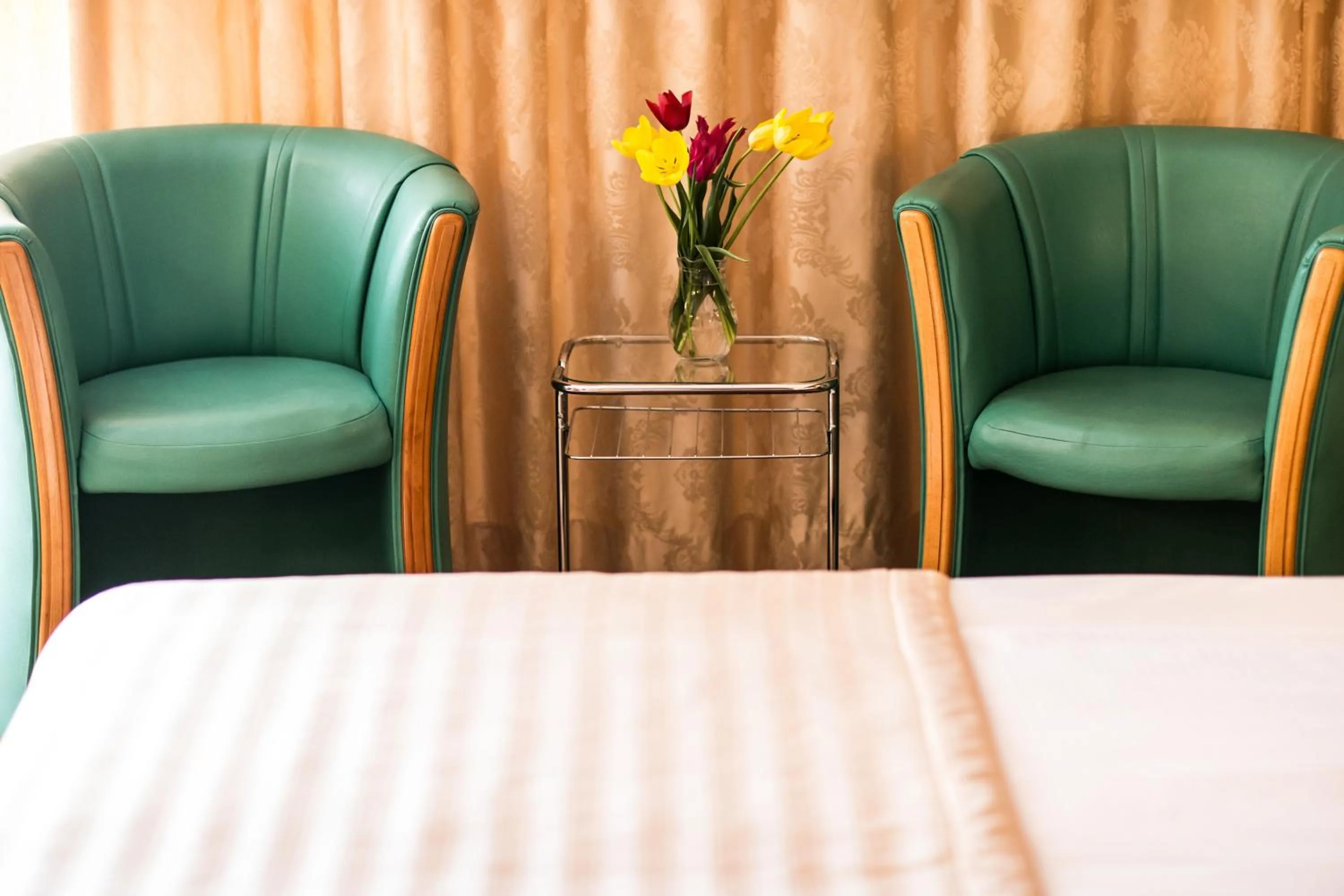 Bed in Ambassador Hotel