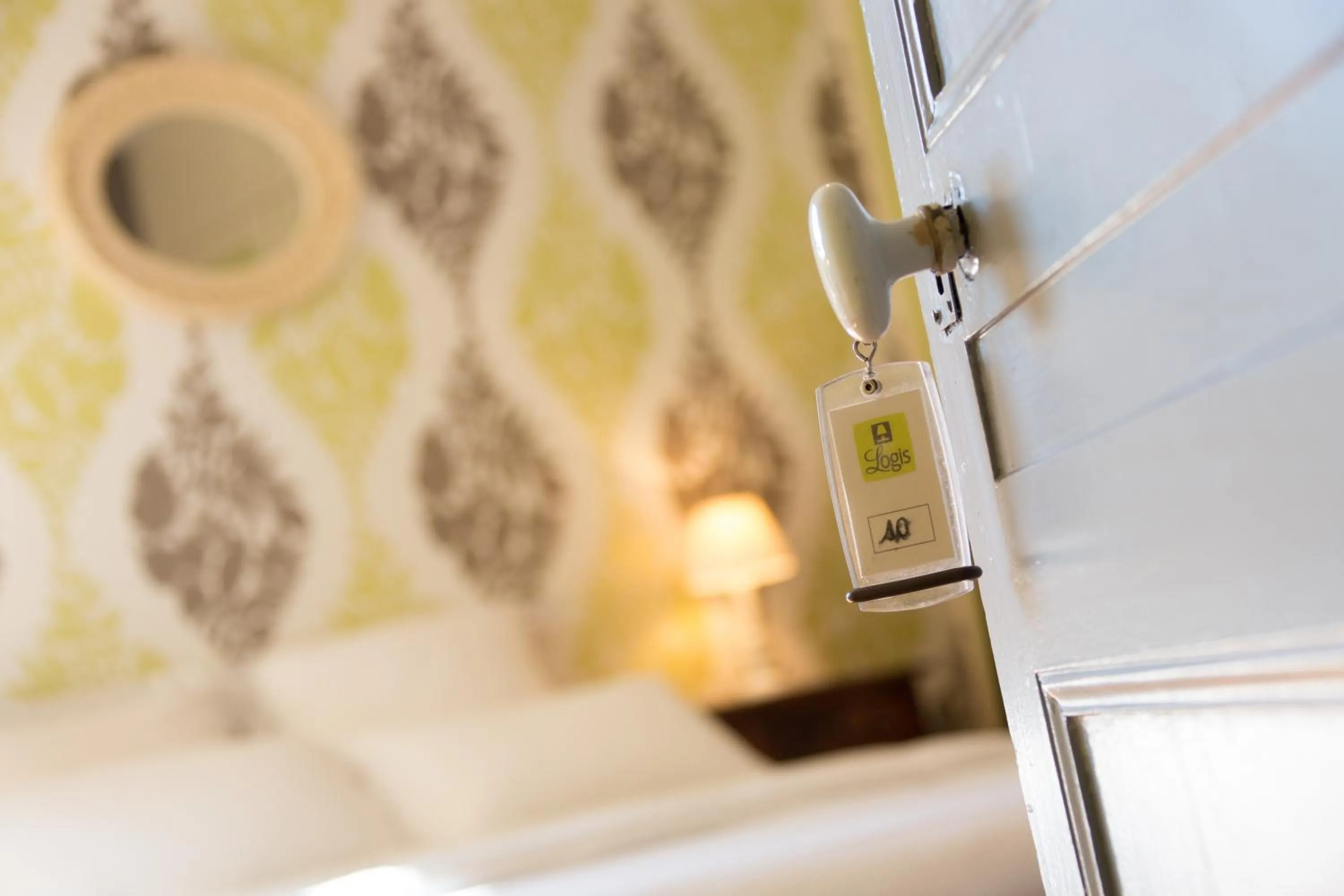 Bed in Logis Hôtel Restaurant La Brasserie