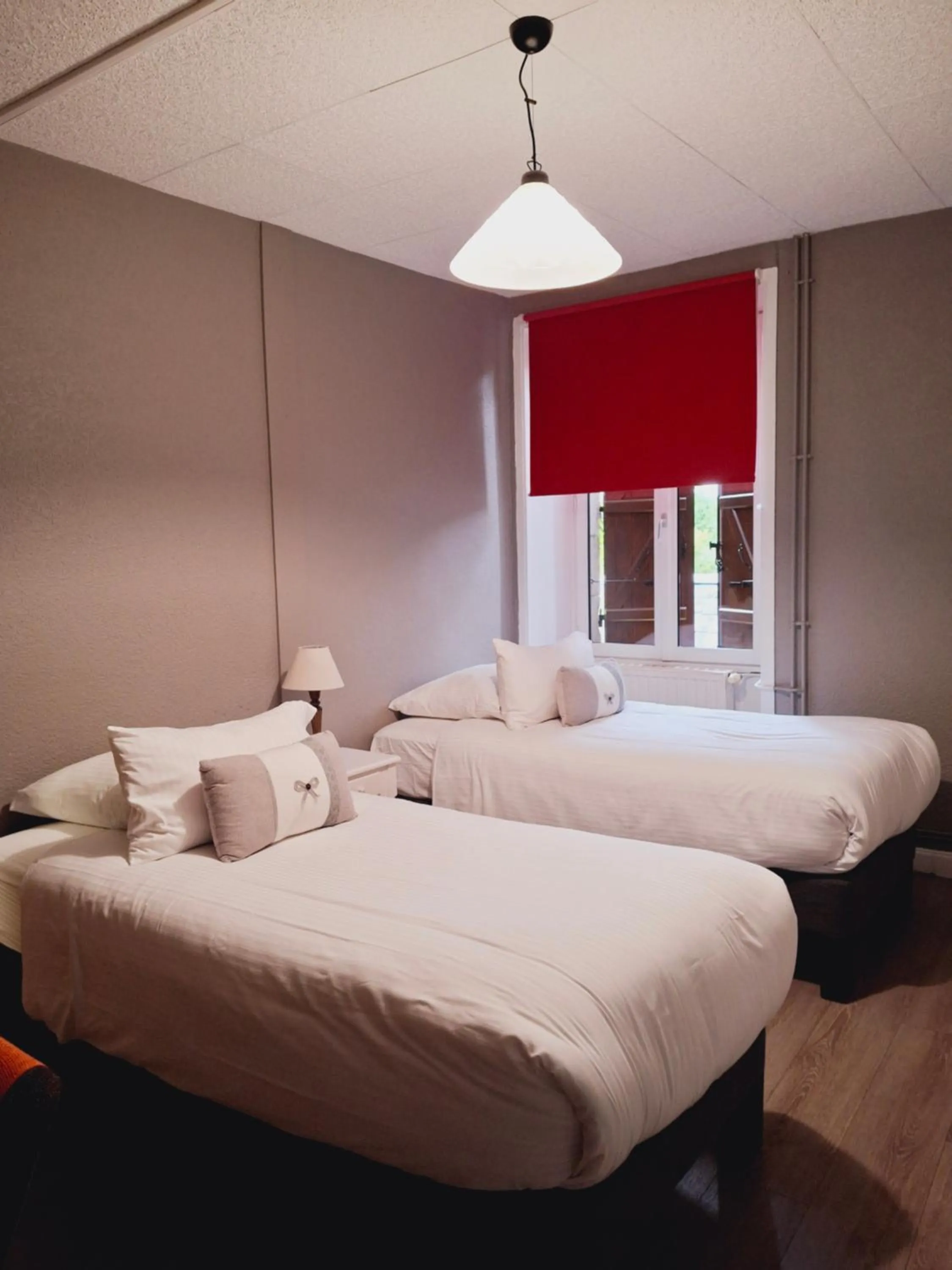 Bed in Logis Hôtel Restaurant La Brasserie