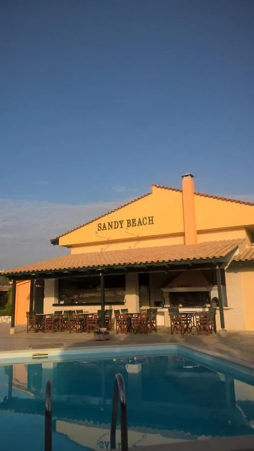 Property logo or sign in Sandy Beach Villas and Apartments