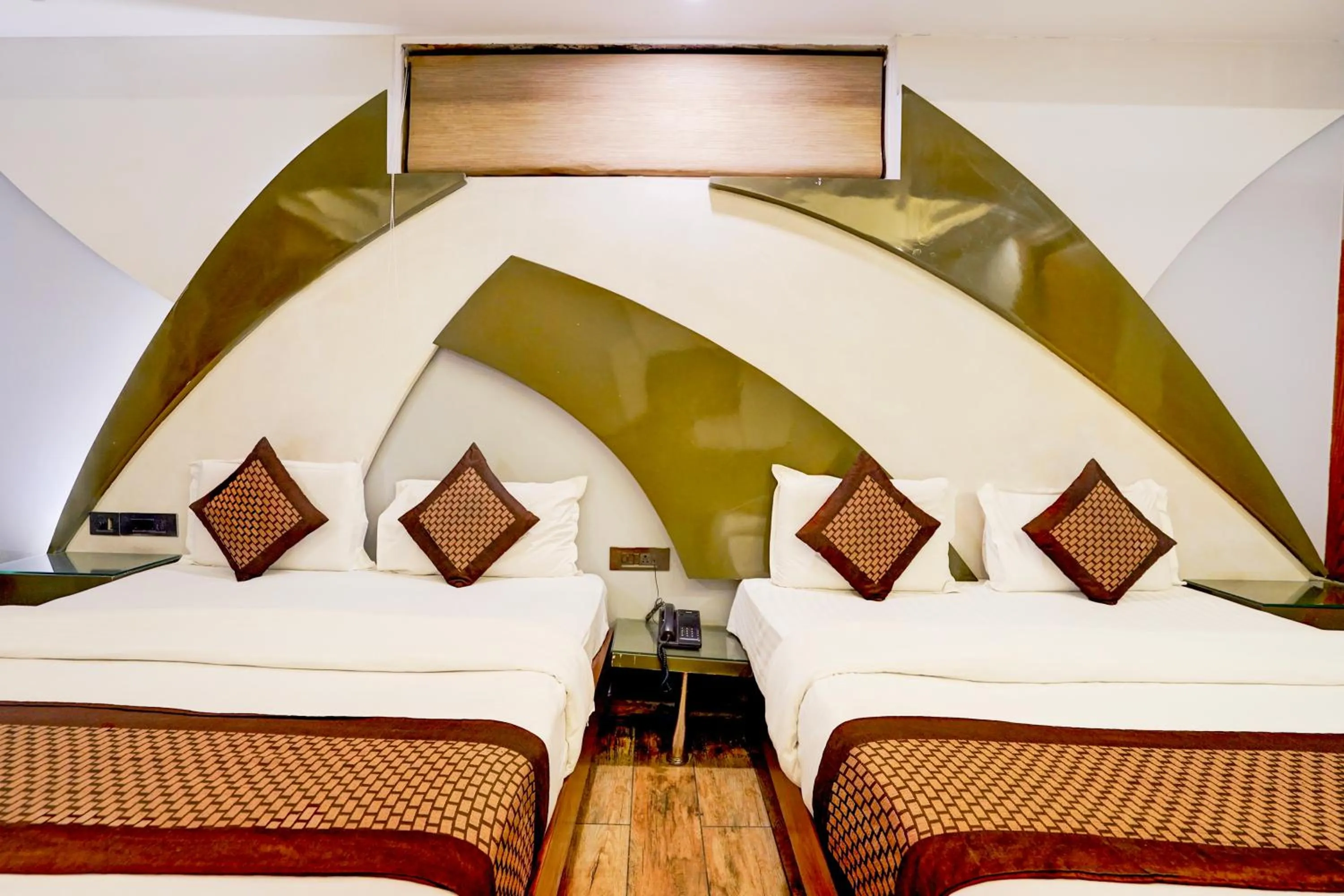Bed in Staybook Hotel Nitya Maharani, Free Airport Pickup