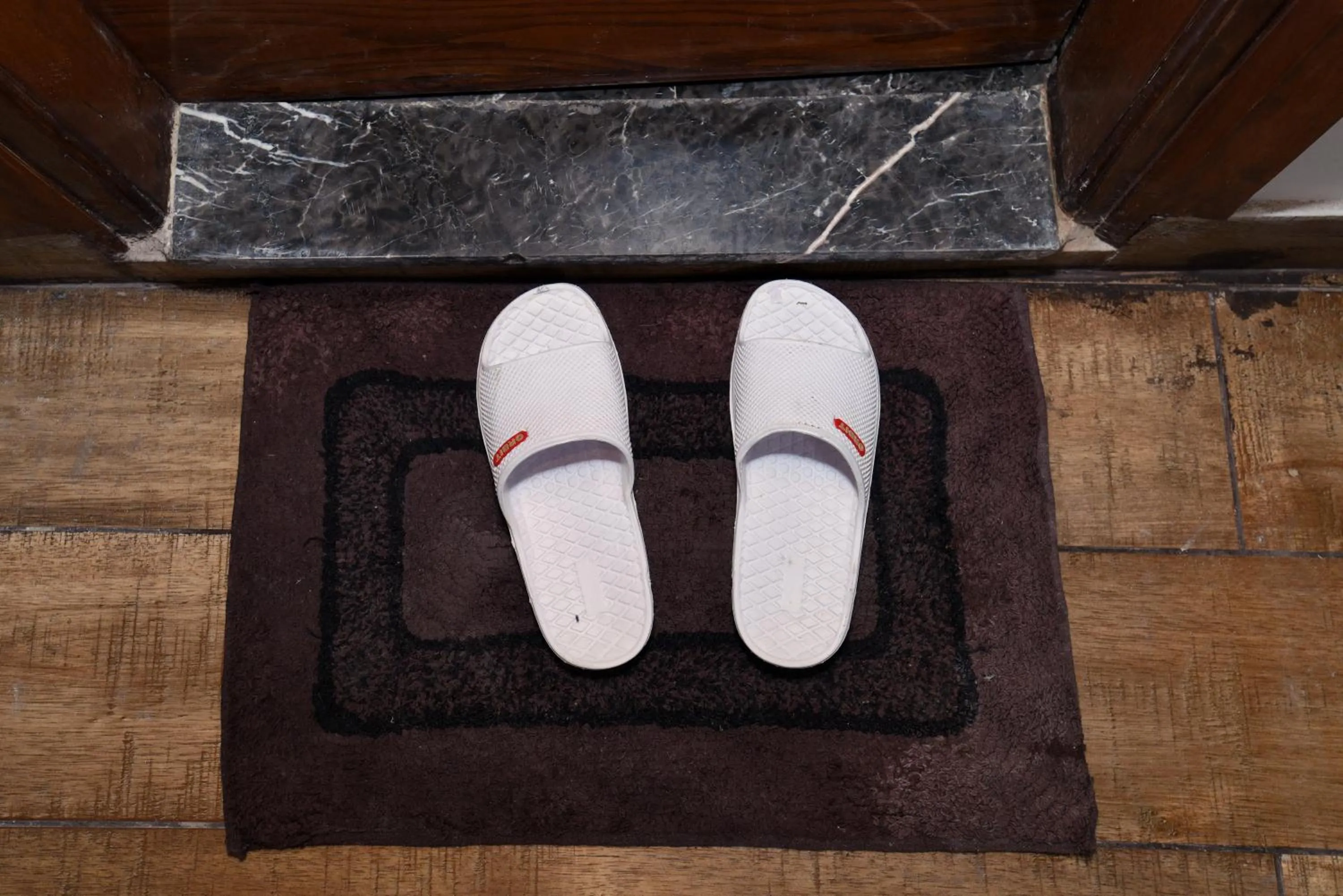 Bathroom in Staybook Hotel Nitya Maharani, Free Airport Pickup