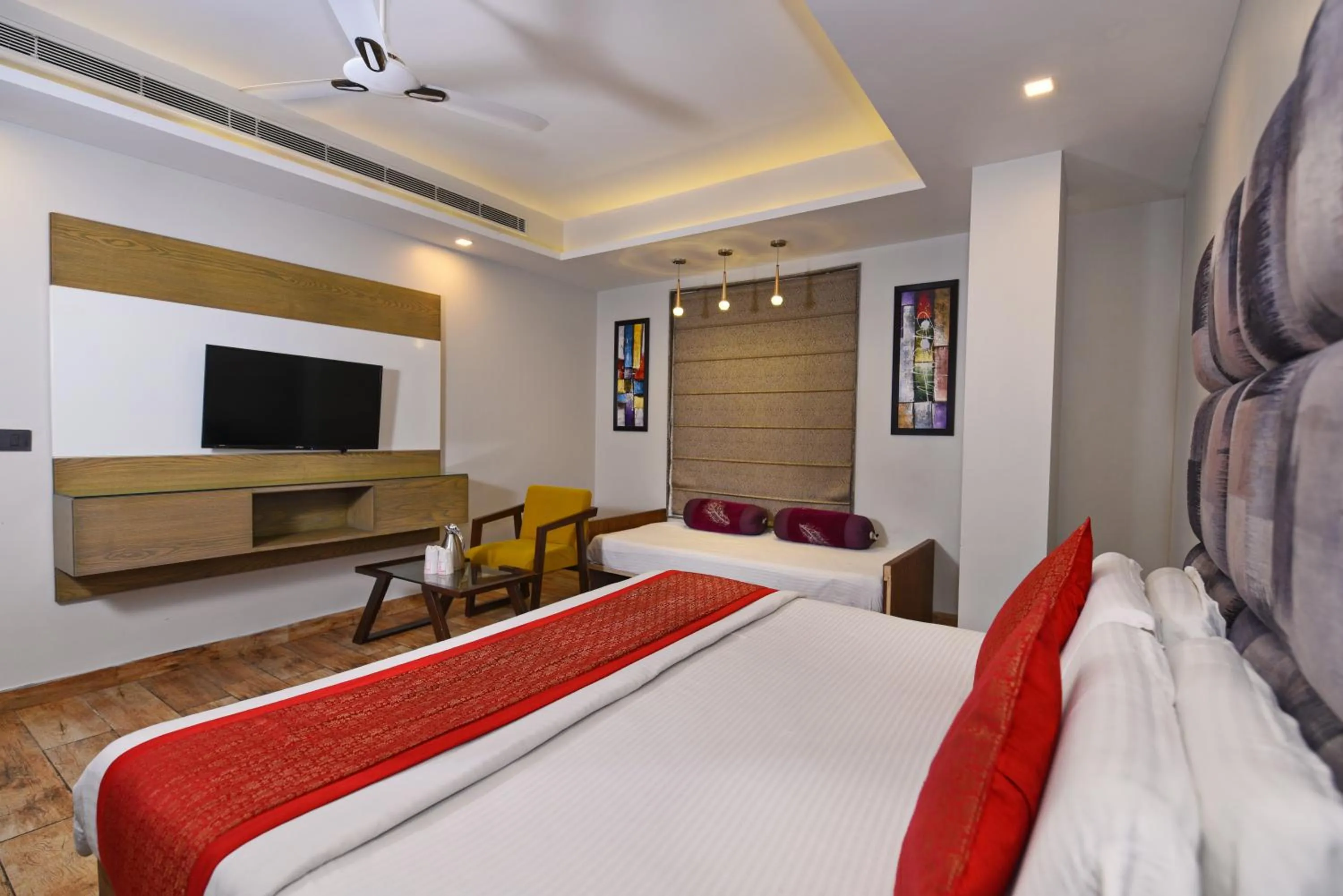 Communal lounge/ TV room, Bed in Staybook Hotel Nitya Maharani, Free Airport Pickup