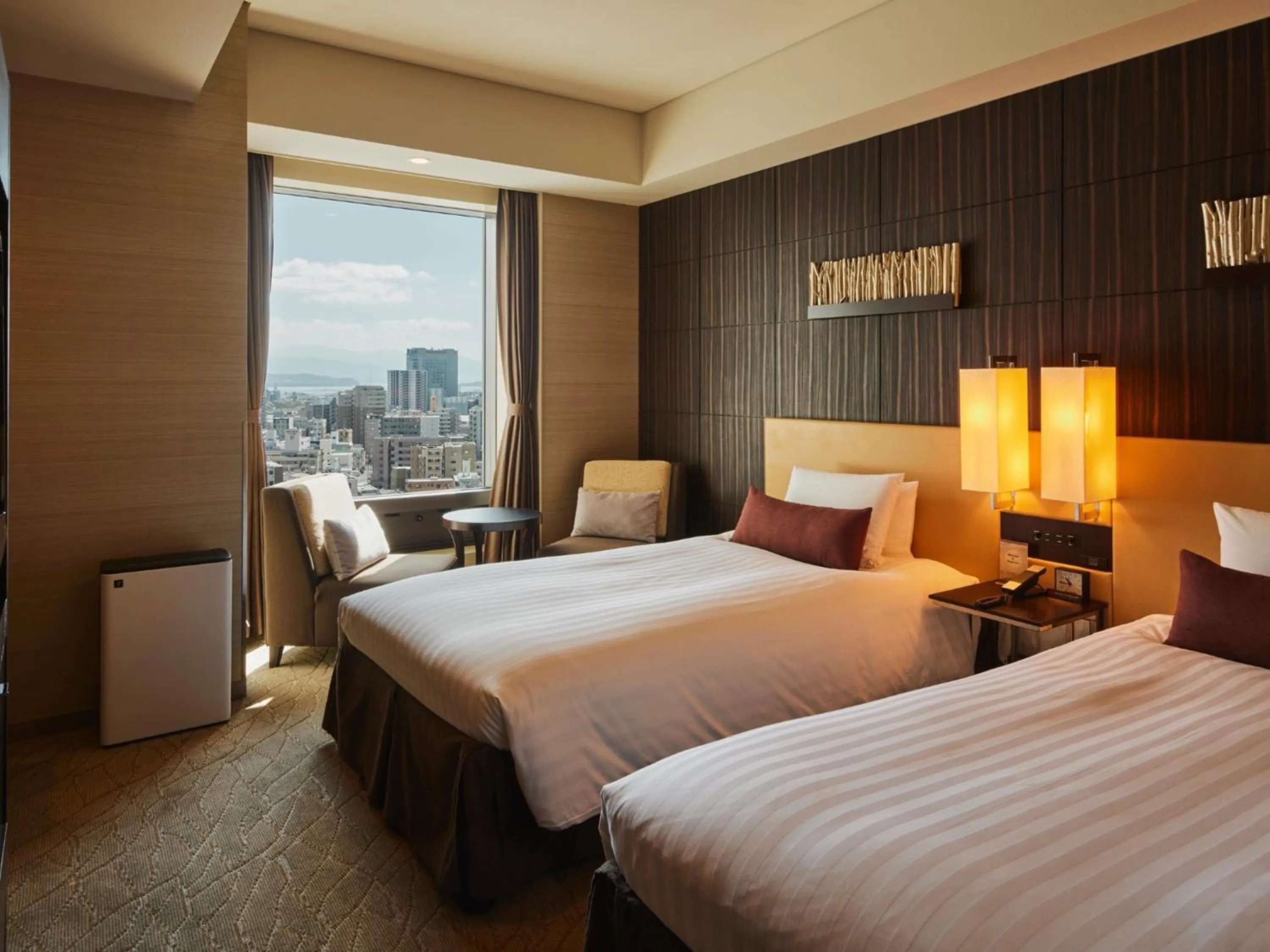 Photo of the whole room, Bed in Solaria Nishitetsu Hotel Kagoshima