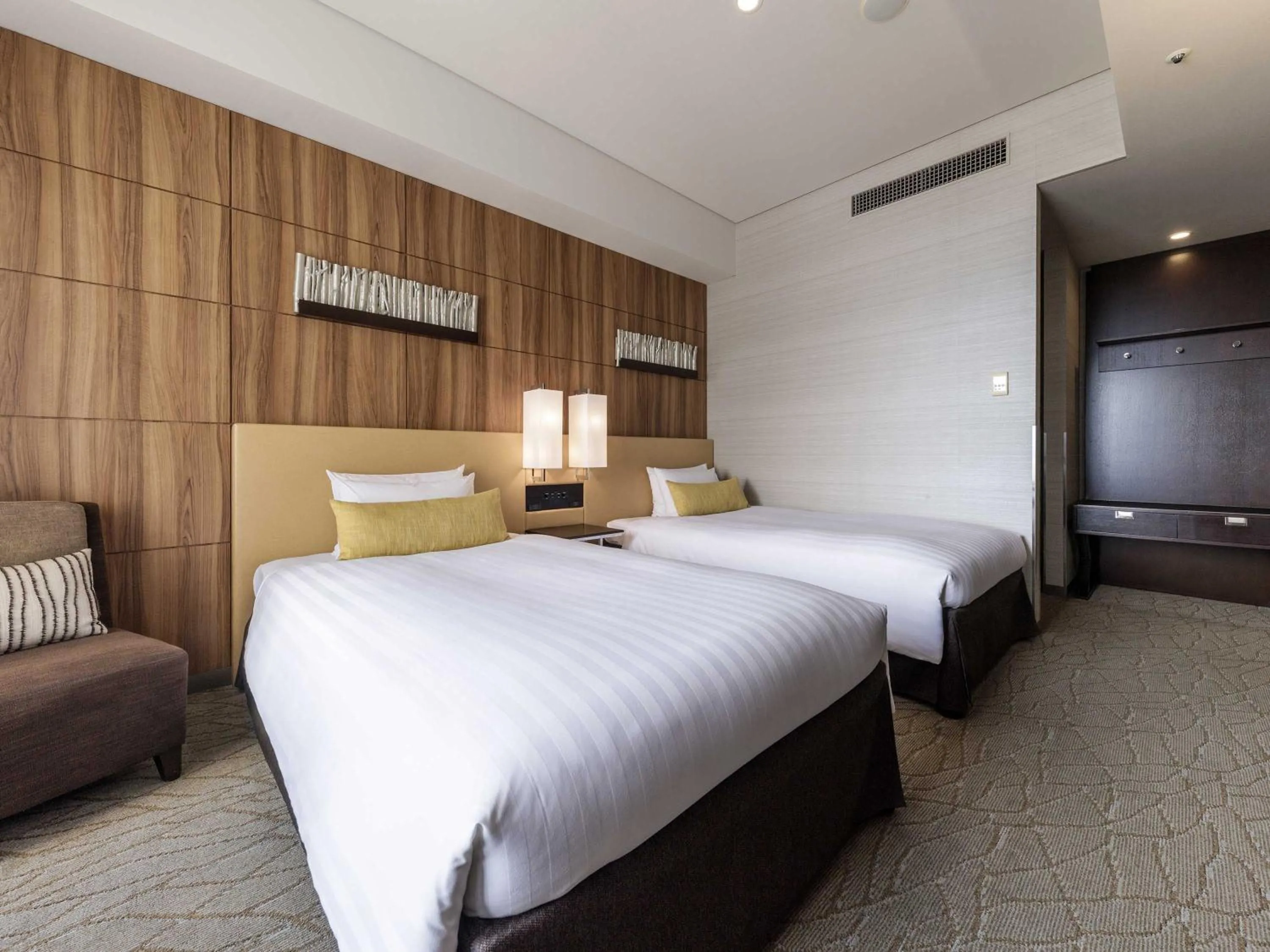 Photo of the whole room, Bed in Solaria Nishitetsu Hotel Kagoshima