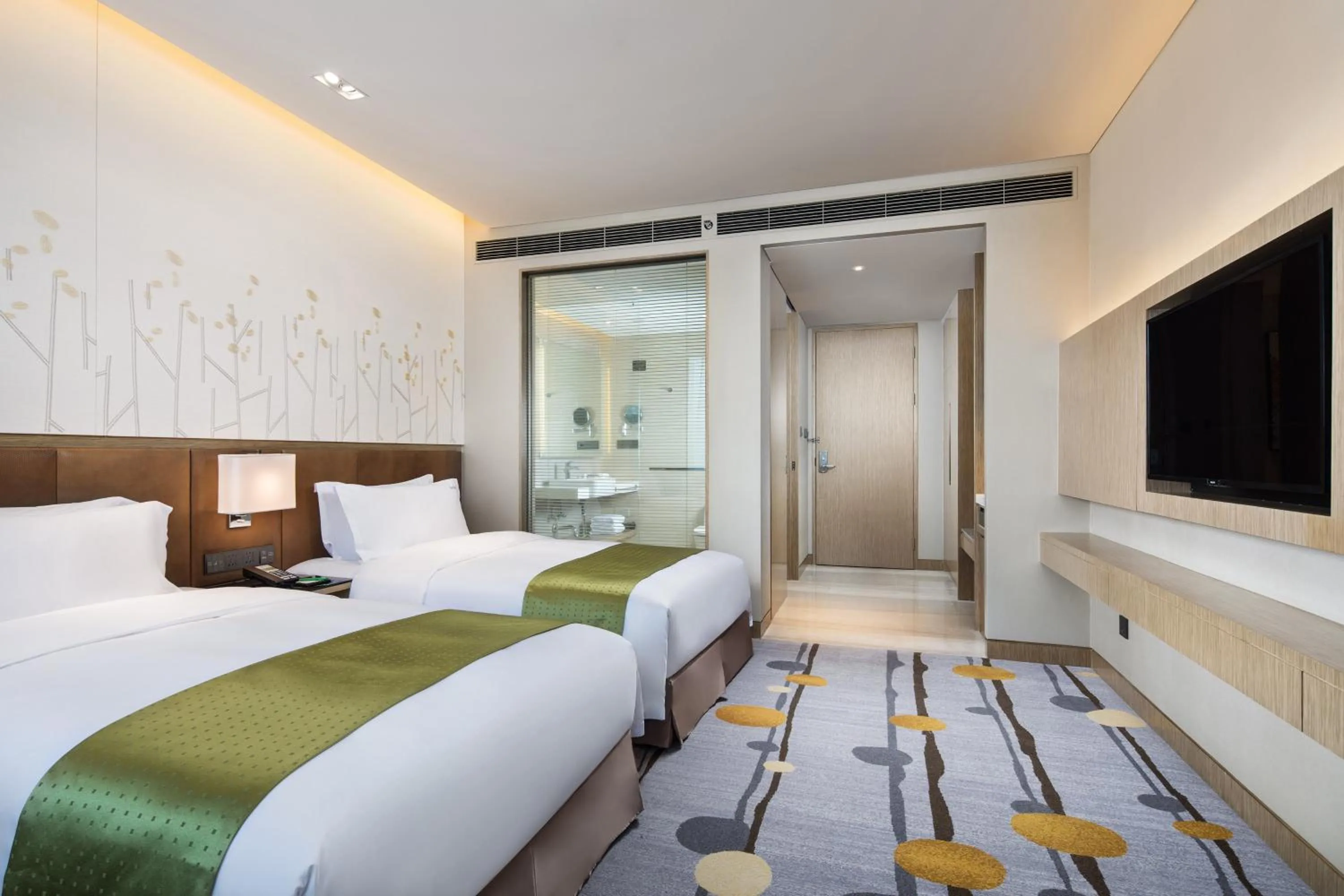 Photo of the whole room, Bed in Holiday Inn Shaoguan Downtown by IHG
