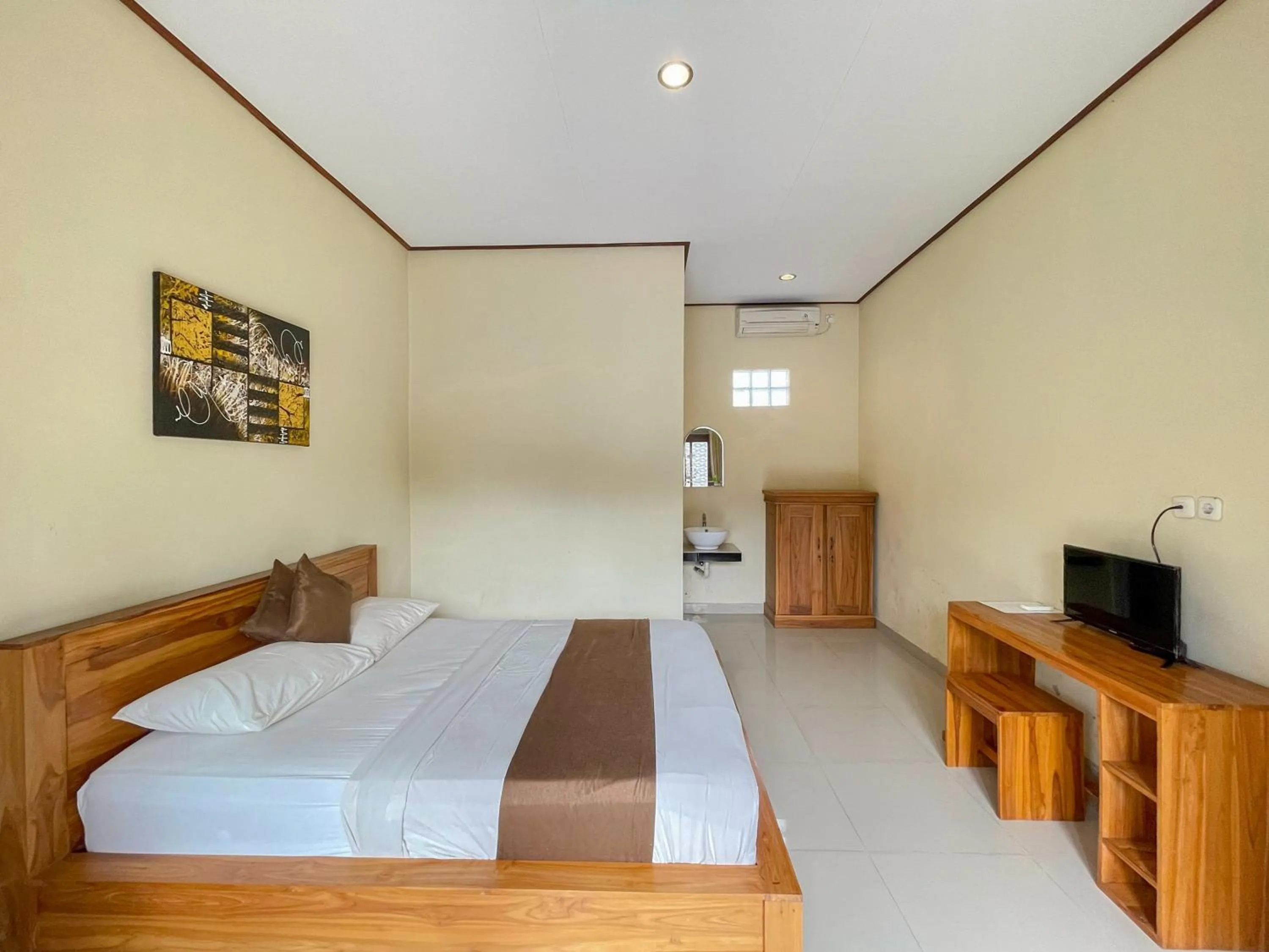 Bedroom, Bed in Urbanview Hotel Lilis Cempaka Mas Guesthouse