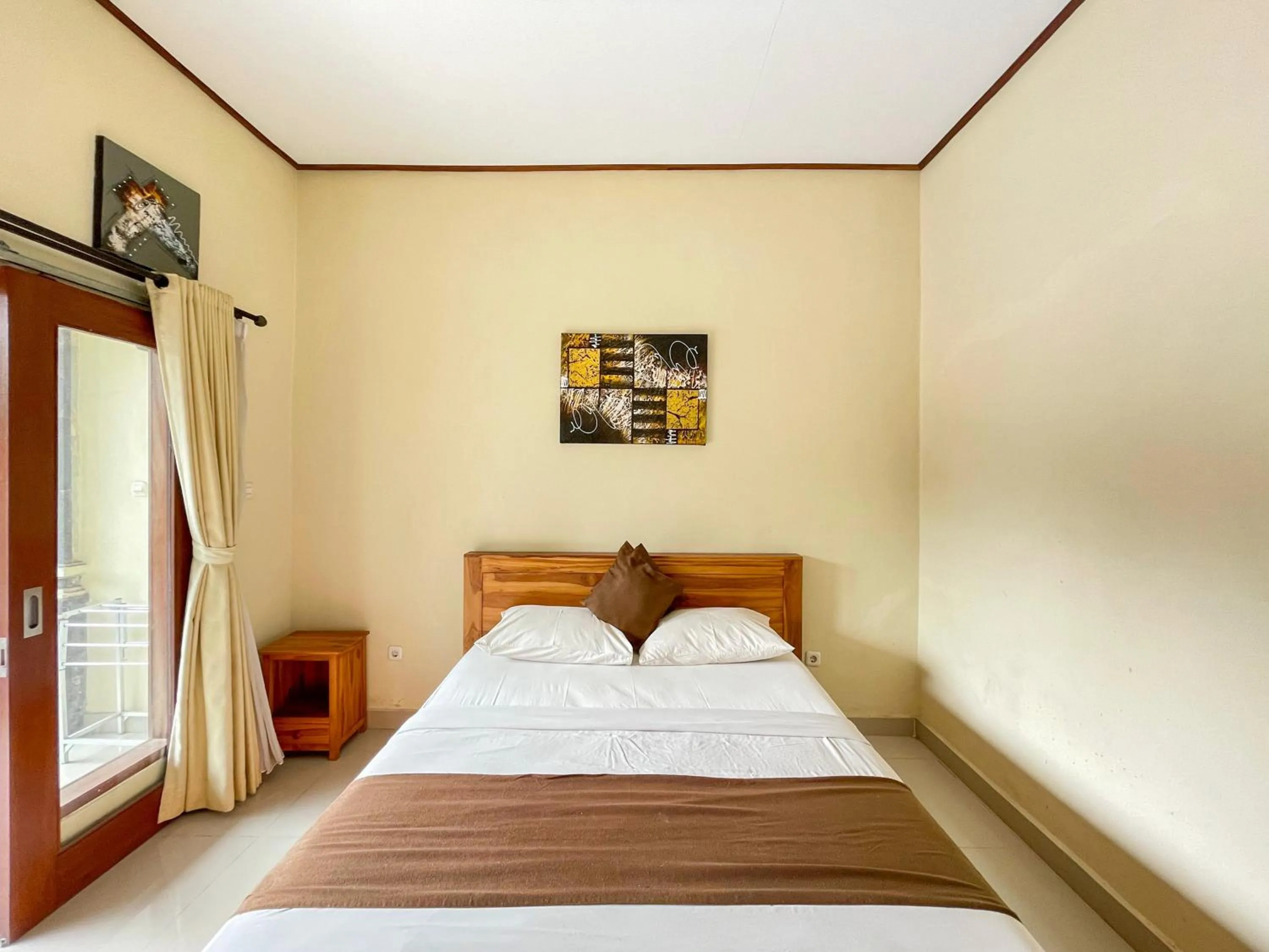 Bedroom, Bed in Urbanview Hotel Lilis Cempaka Mas Guesthouse