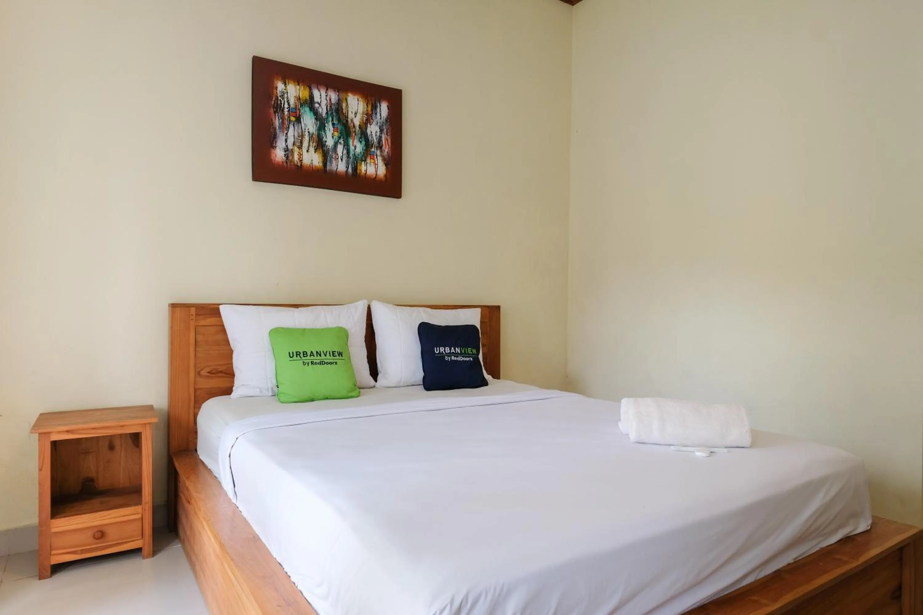 Bed in Urbanview Hotel Lilis Cempaka Mas Guesthouse
