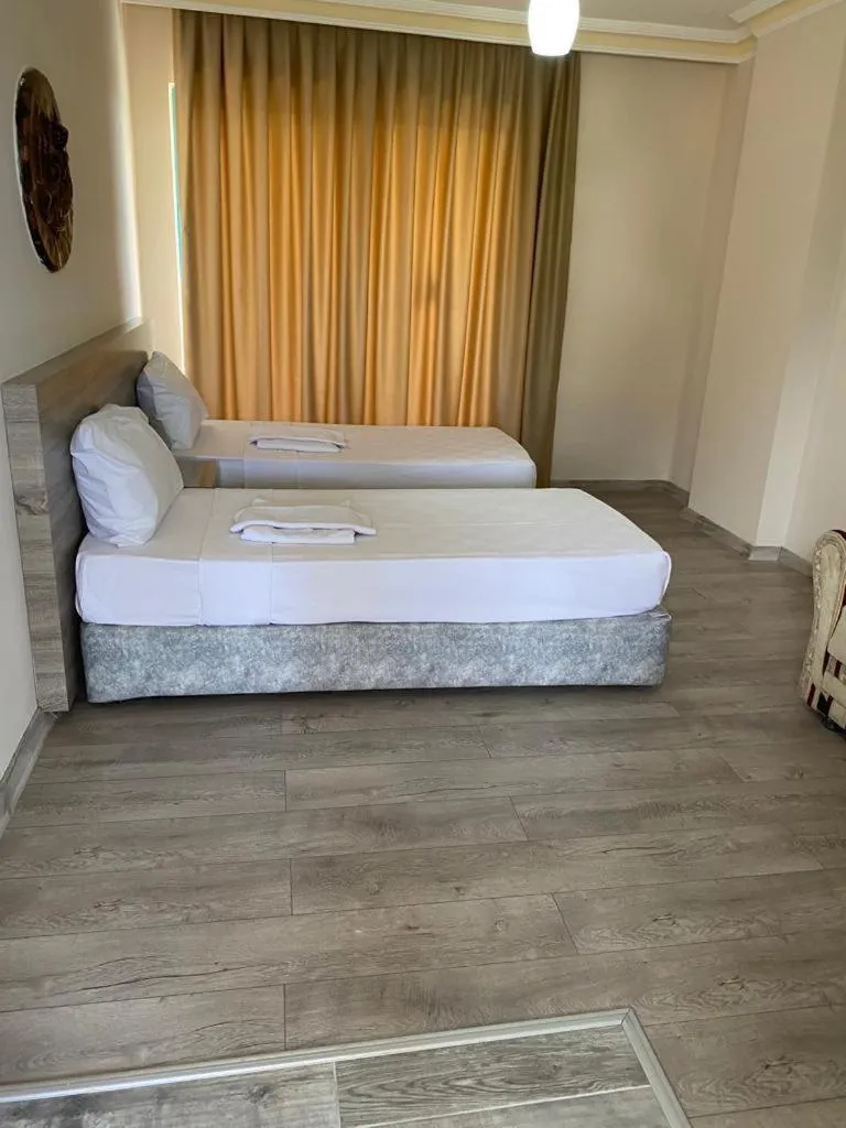 Bed in Cinar Family Suite Hotel