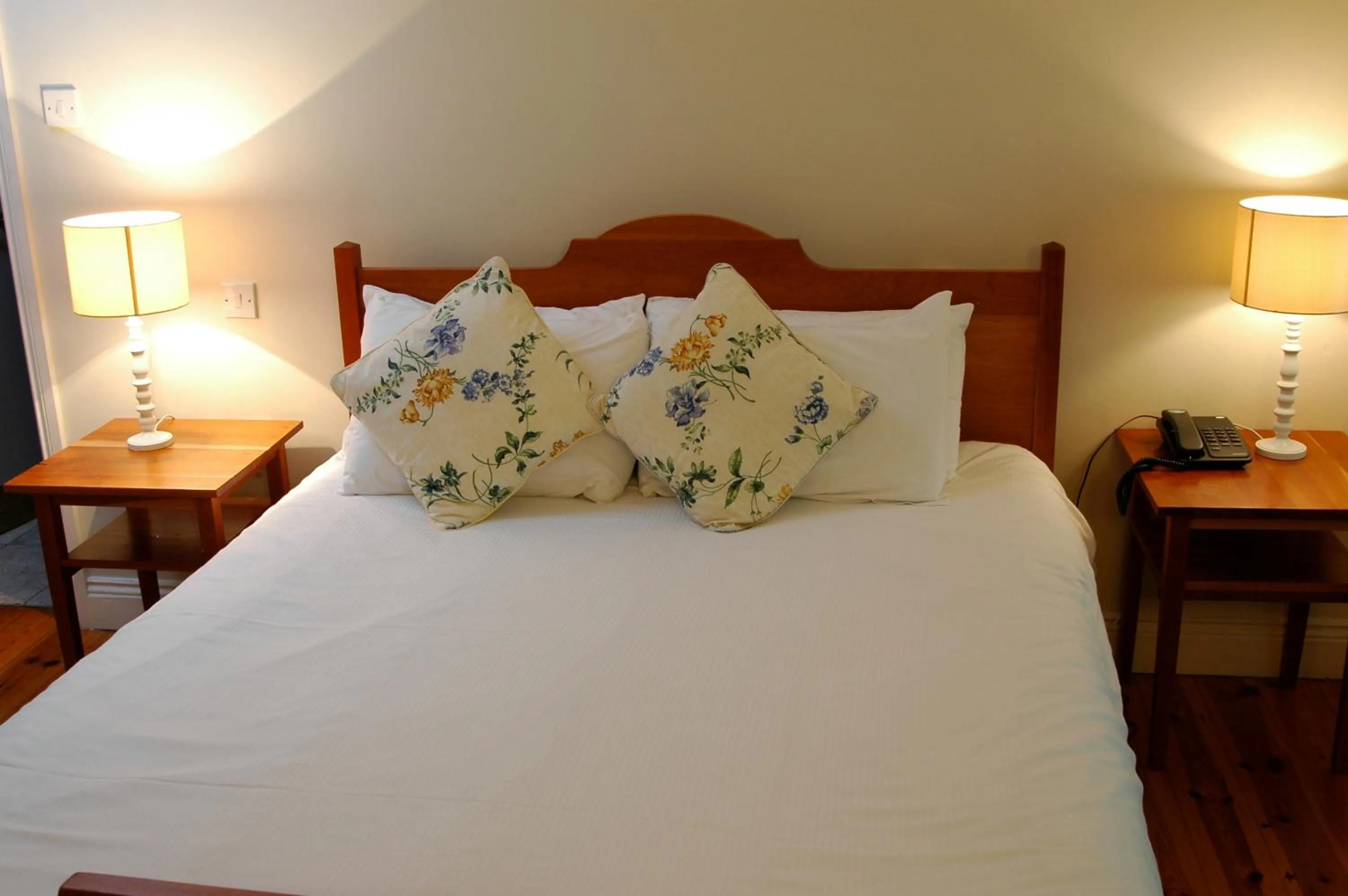 Bed in The Waterfront Hotel