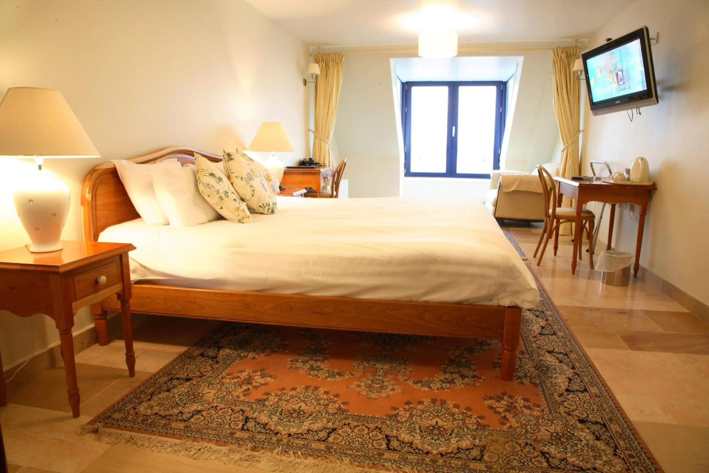 Bed in The Waterfront Hotel
