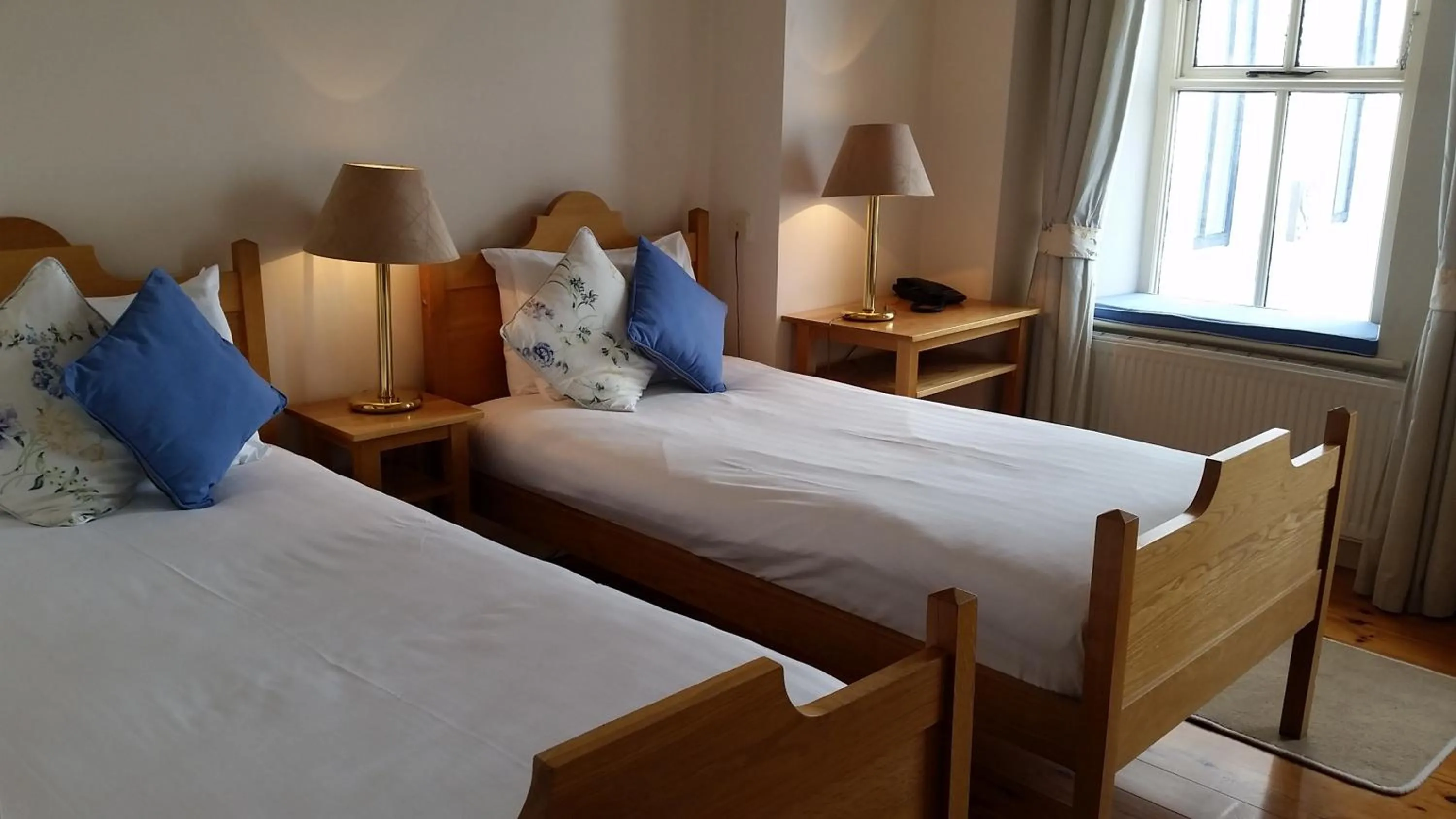 Bed in The Waterfront Hotel