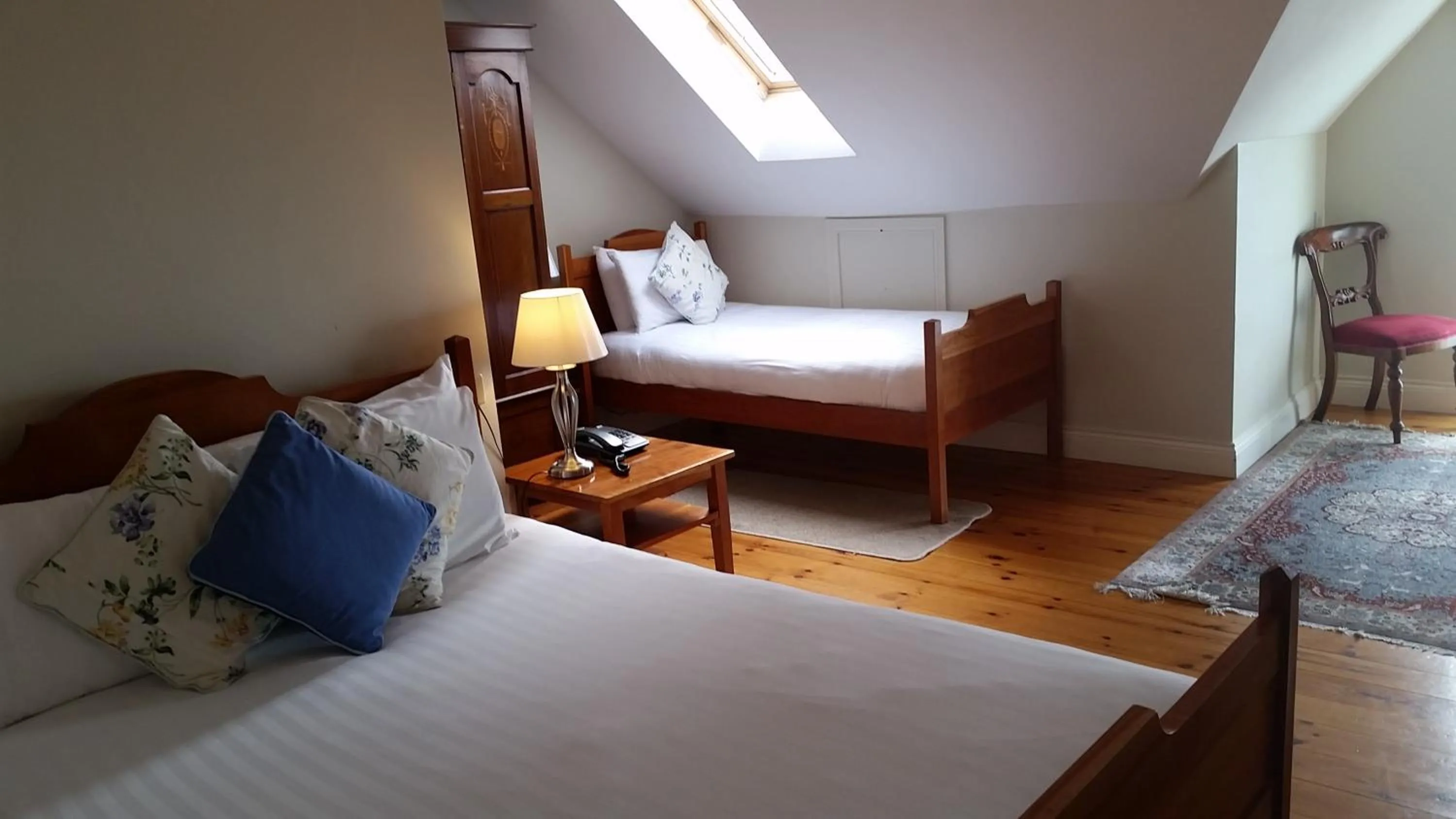 Bed in The Waterfront Hotel