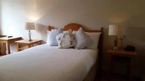 Bed in The Waterfront Hotel