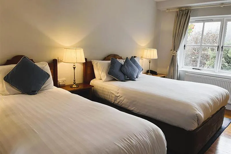 Bed in The Waterfront Hotel
