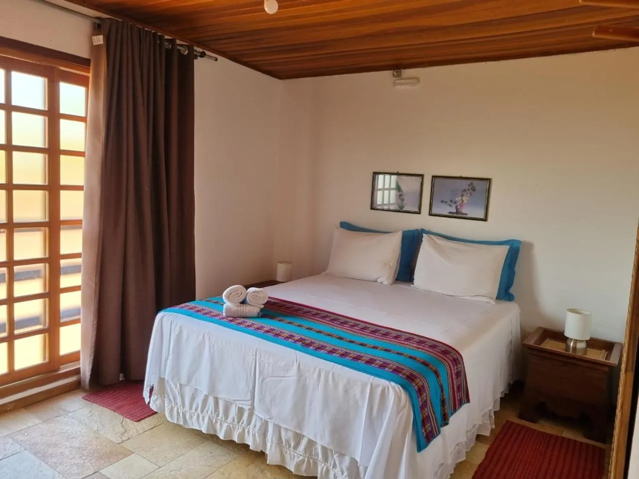 Bed in Pousada Ikabana