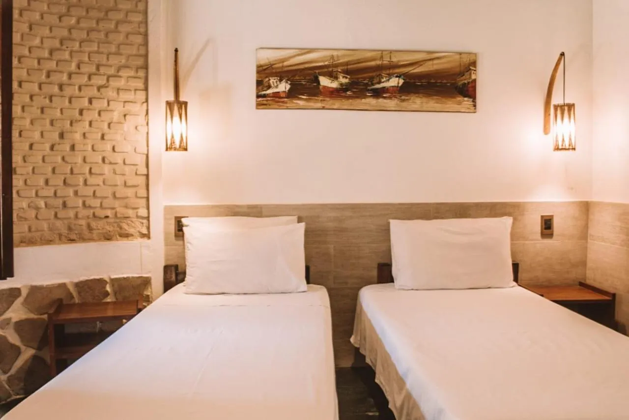 Bed in Pousada El Capitan