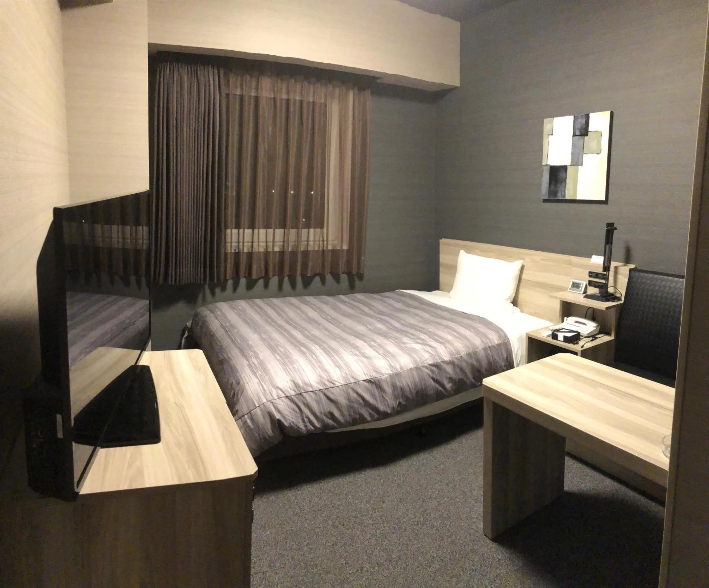 Bed in Hotel Route-Inn Grand Muroran