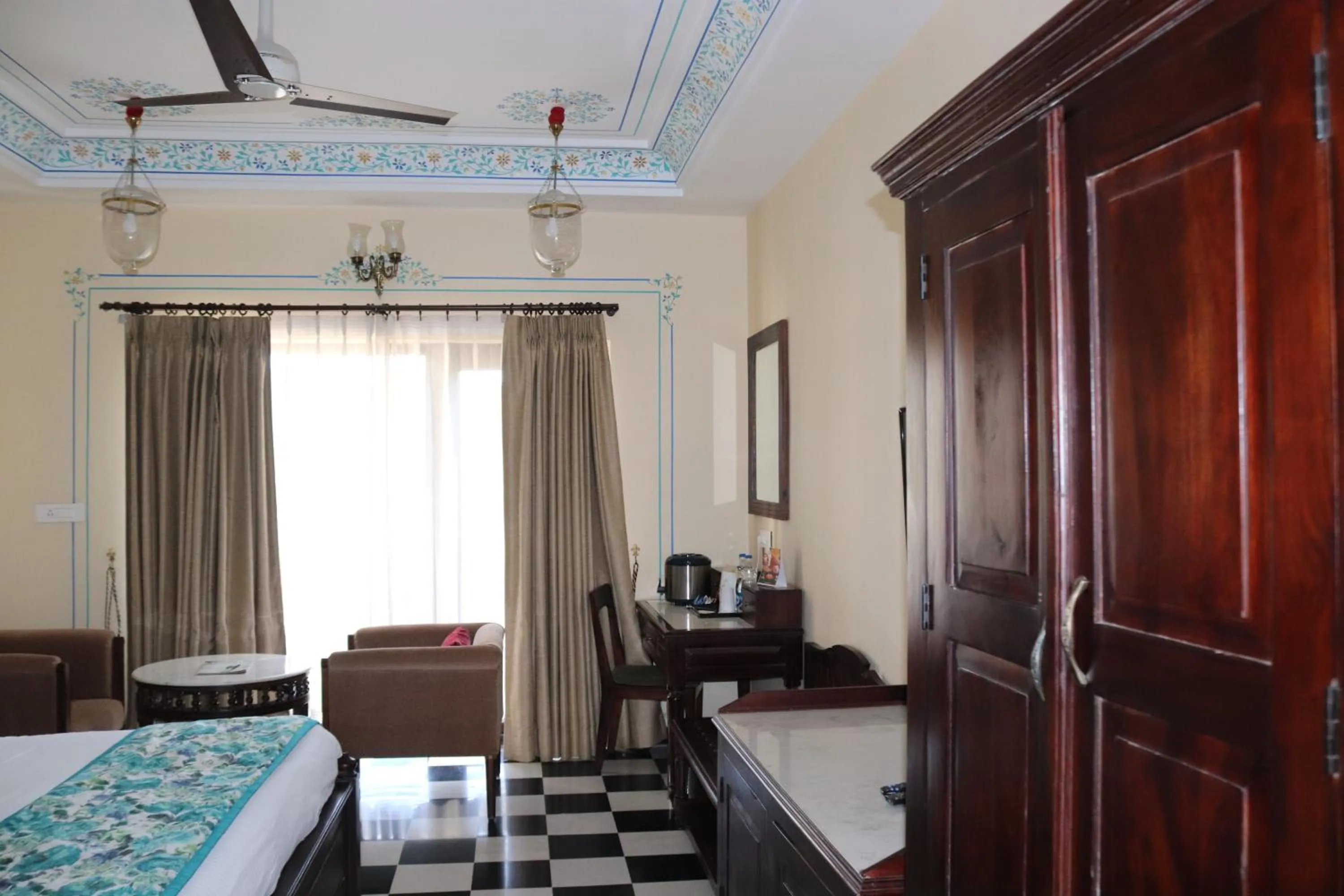 Seating area, Bed in The Kumbha Residency by Trulyy - A Luxury Resort and Spa