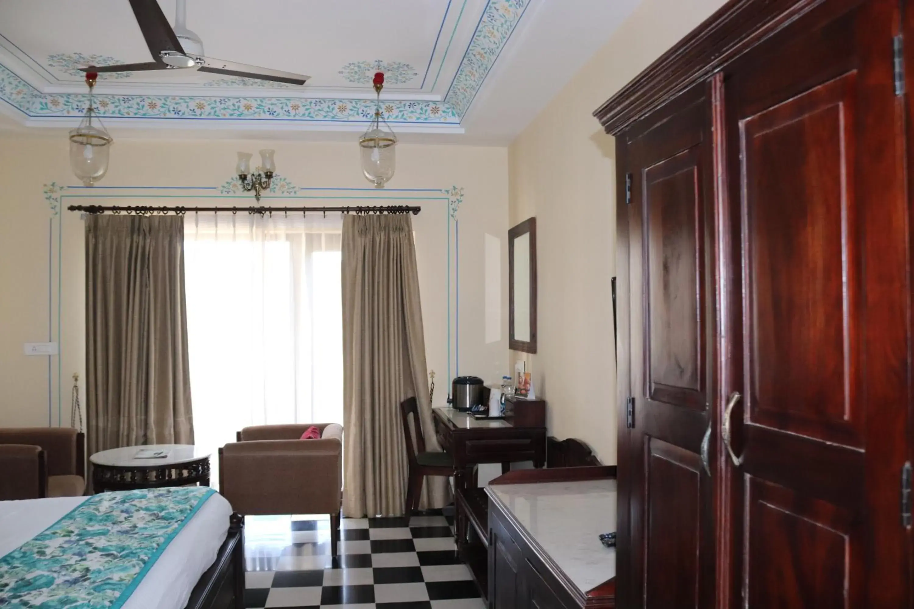 Seating area, Bed in The Kumbha Residency by Trulyy - A Luxury Resort and Spa Seating area, Bed in The Kumbha Residency by Trulyy - A Luxury Resort and Spa