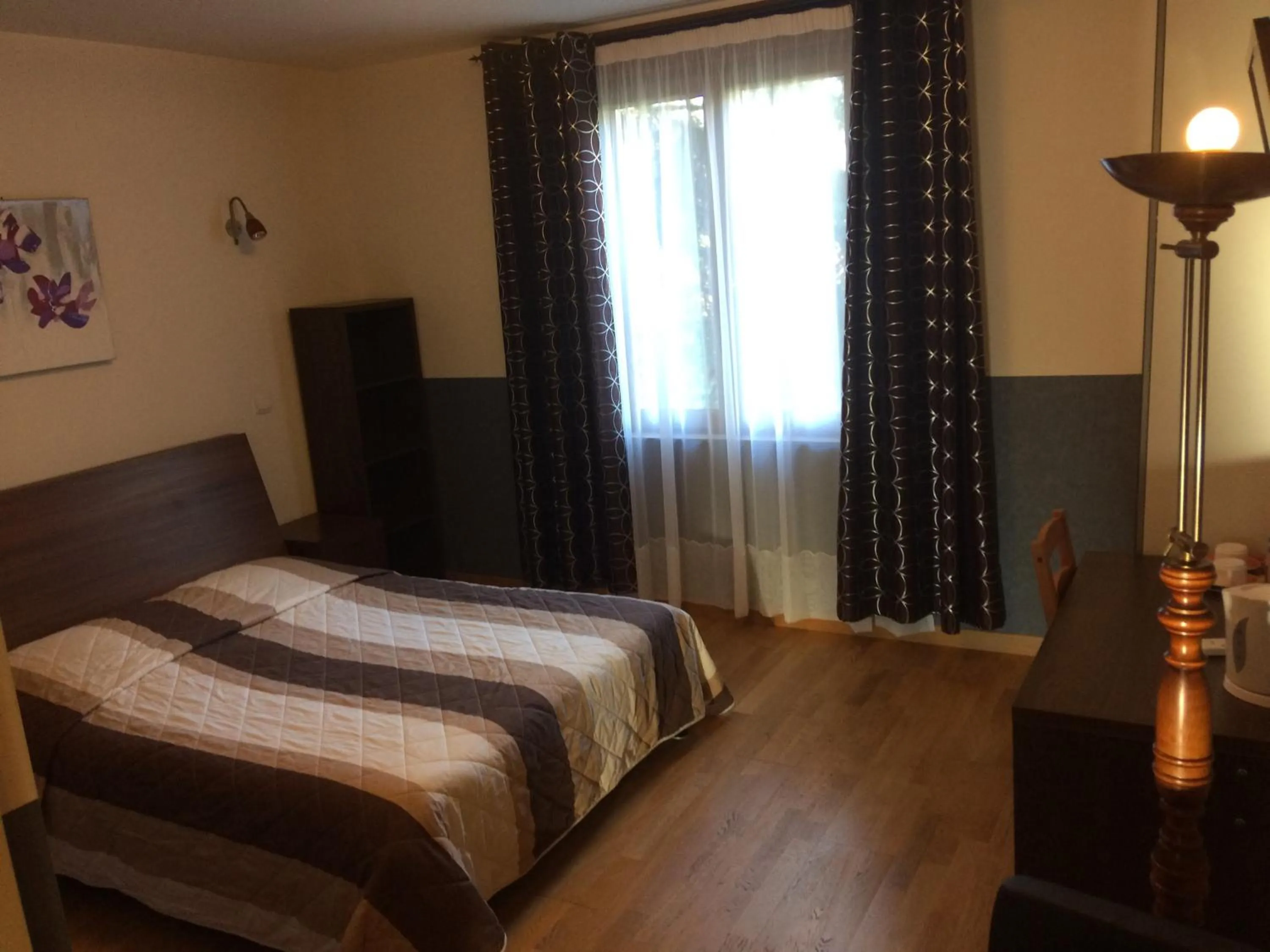 Bed in LOGIS Hôtel Le Chantoiseau