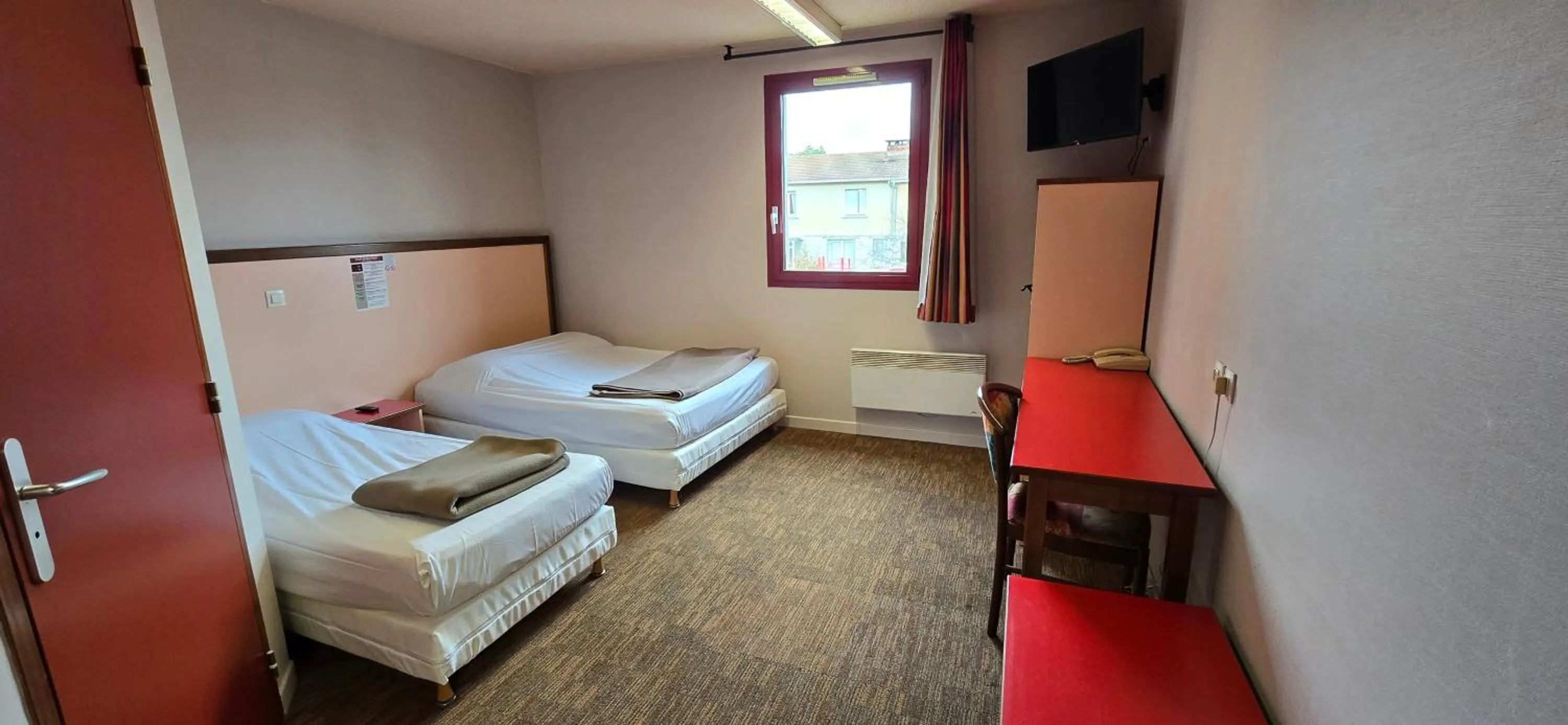 Bed in Hôtel Siatel Besançon Chateaufarine