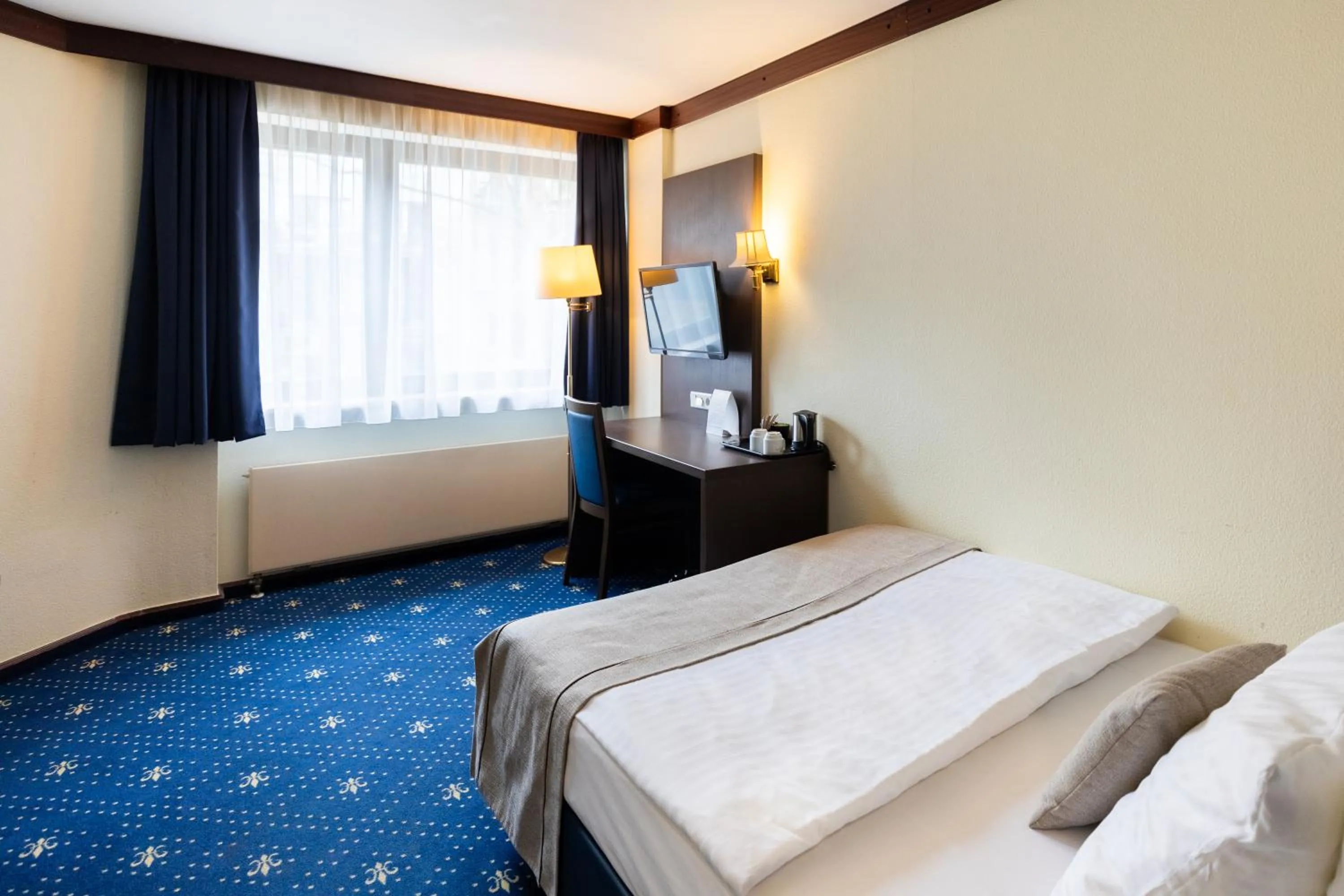 Bed in Novum Hotel Imperial Frankfurt Messe