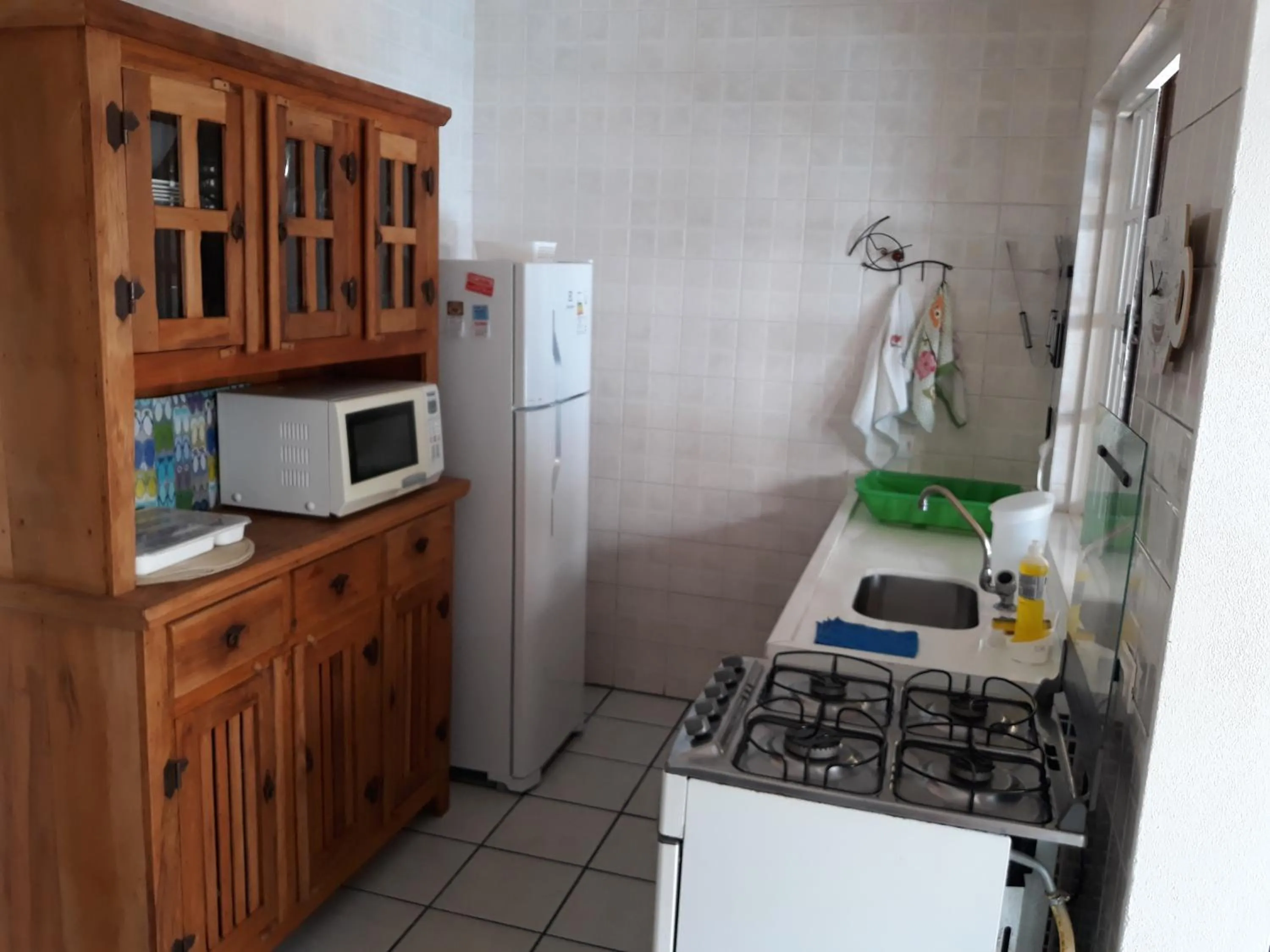 Communal kitchen in Casa em condomínio