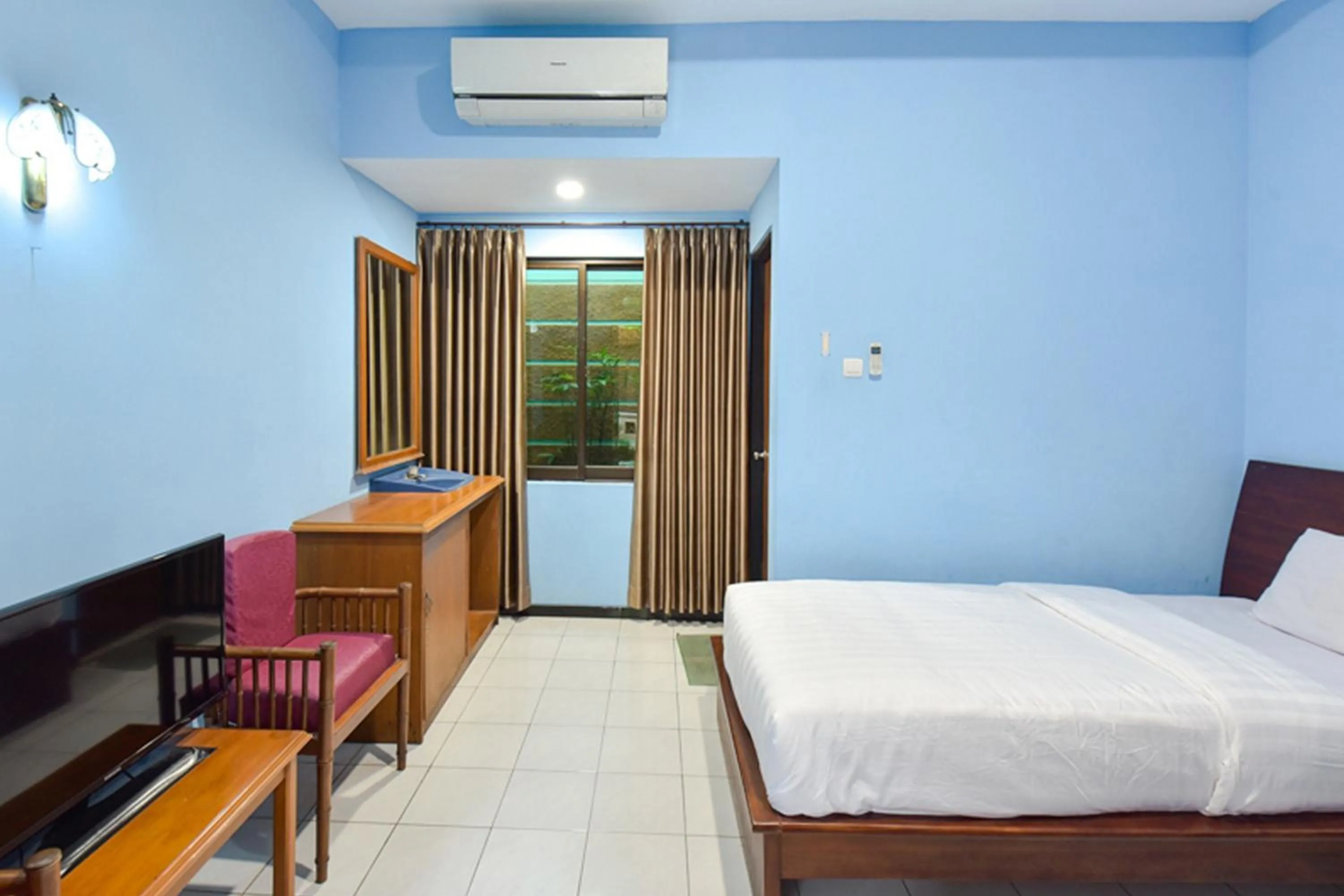 Bed in Sekar Ayu Hotel Malioboro Mitra RedDoorz
