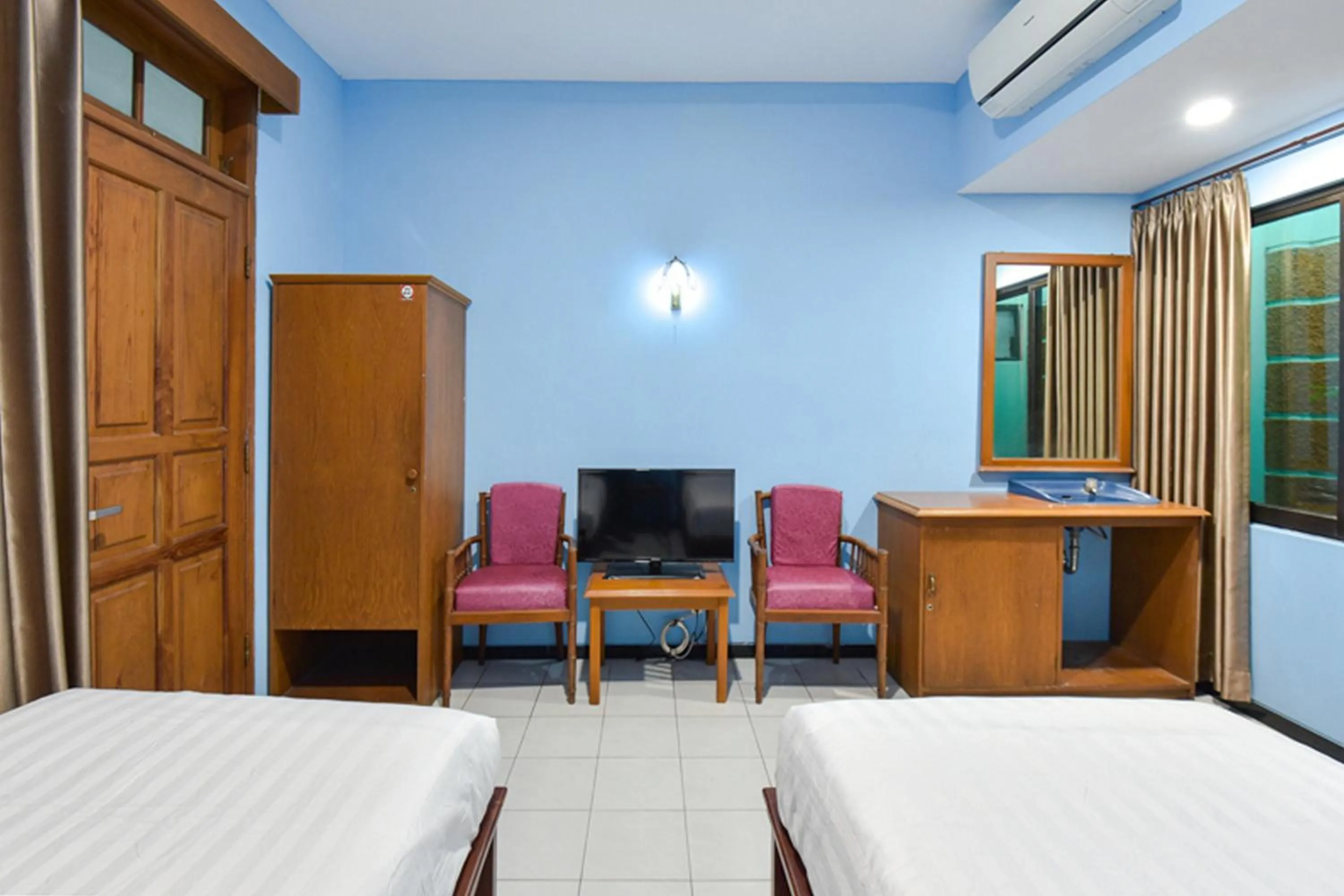 Bed in Sekar Ayu Hotel Malioboro Mitra RedDoorz