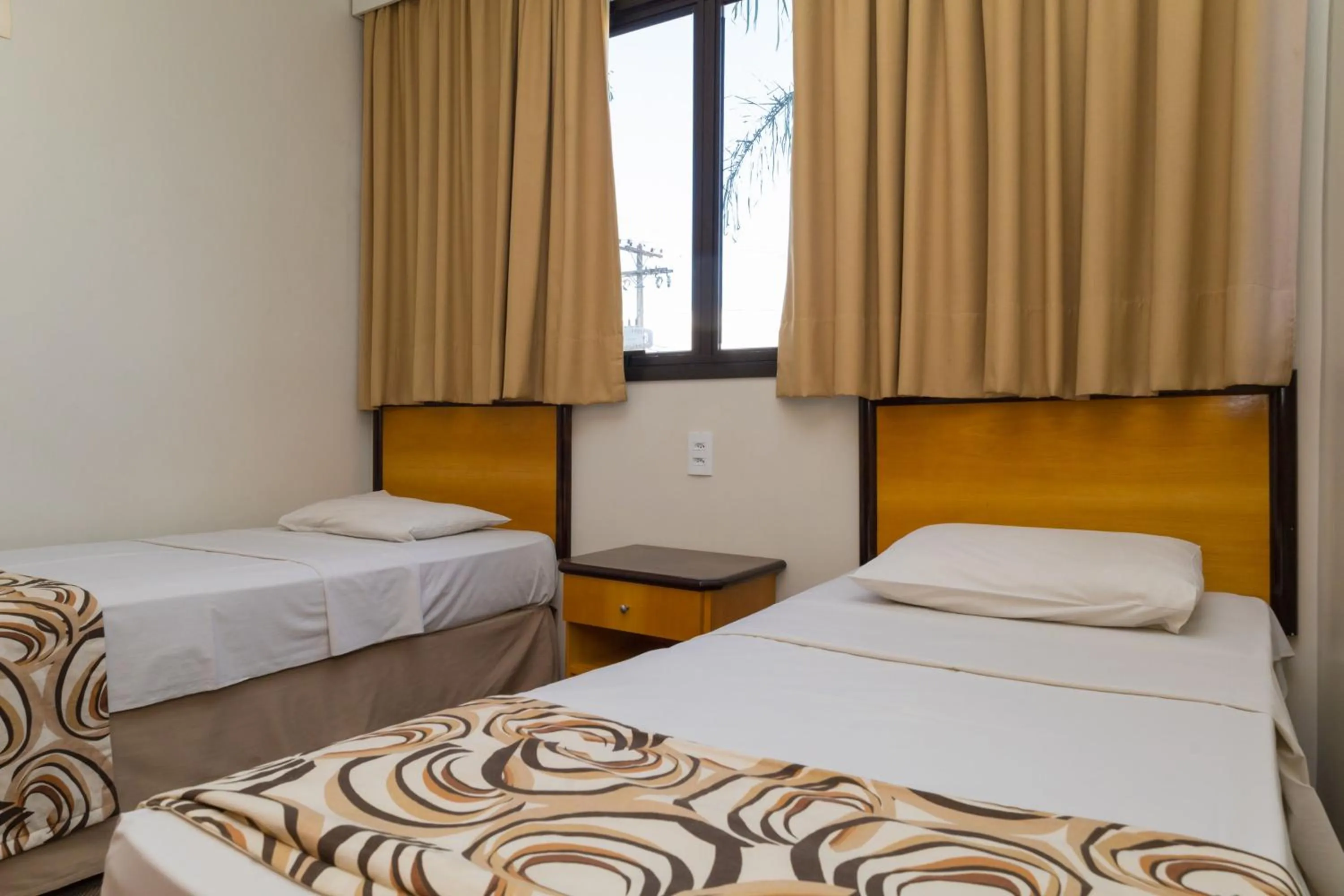 Bed in Golden Suíte Hotel