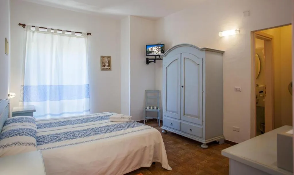 Bed in Hotel Sandalyon