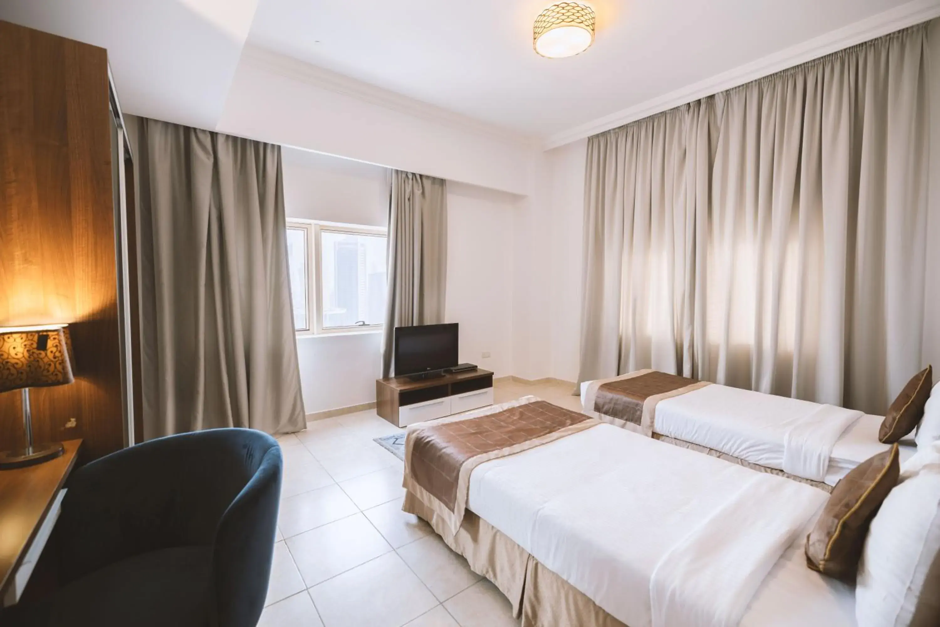 Three-Bedroom Suite in Magnum Hotel & Suites West Bay Three-Bedroom Suite in Magnum Hotel & Suites West Bay