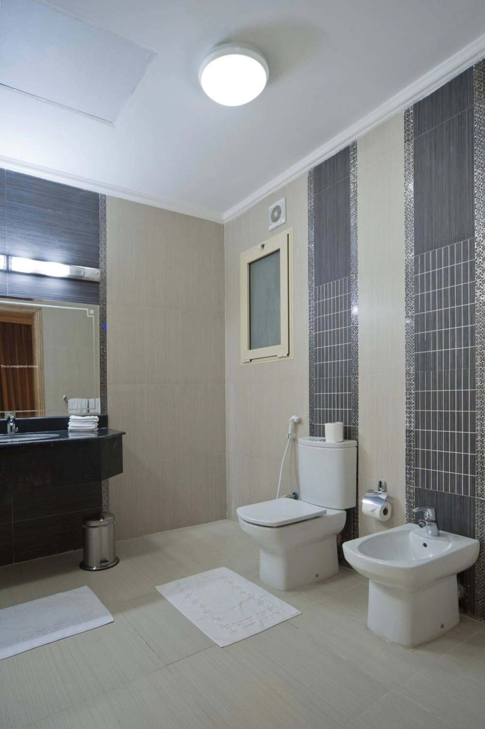 Bathroom in Magnum Hotel & Suites West Bay