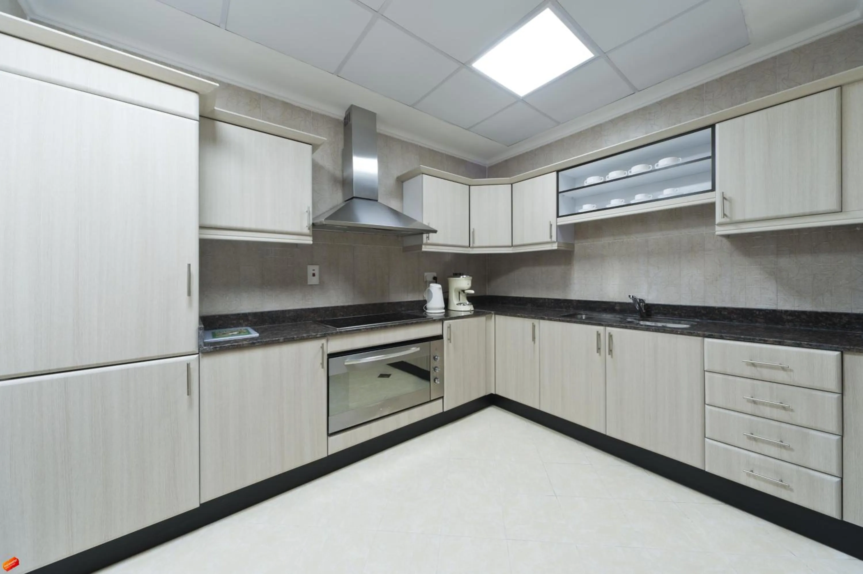 Kitchen or kitchenette in Magnum Hotel & Suites West Bay