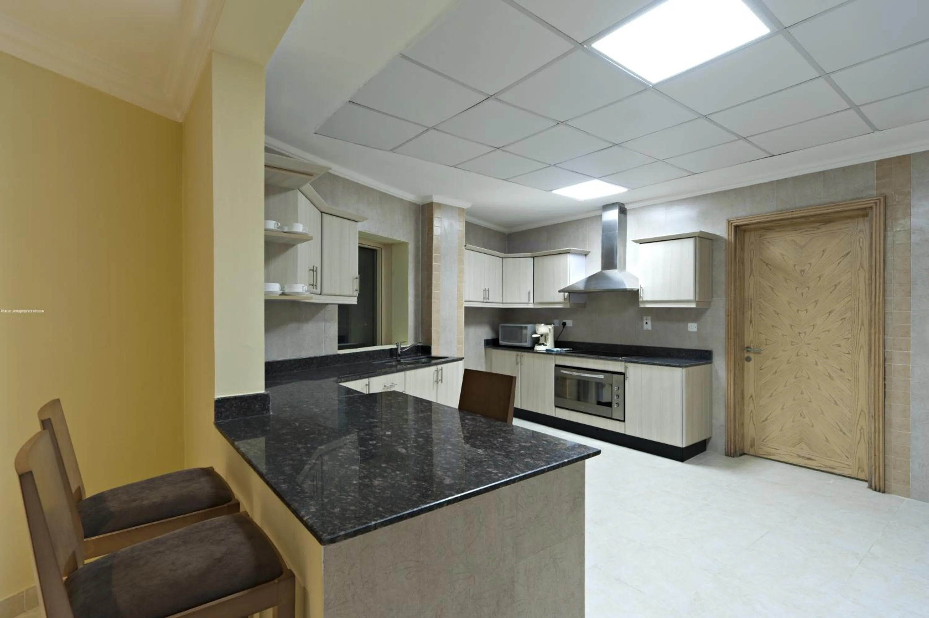 Kitchen or kitchenette in Magnum Hotel & Suites West Bay