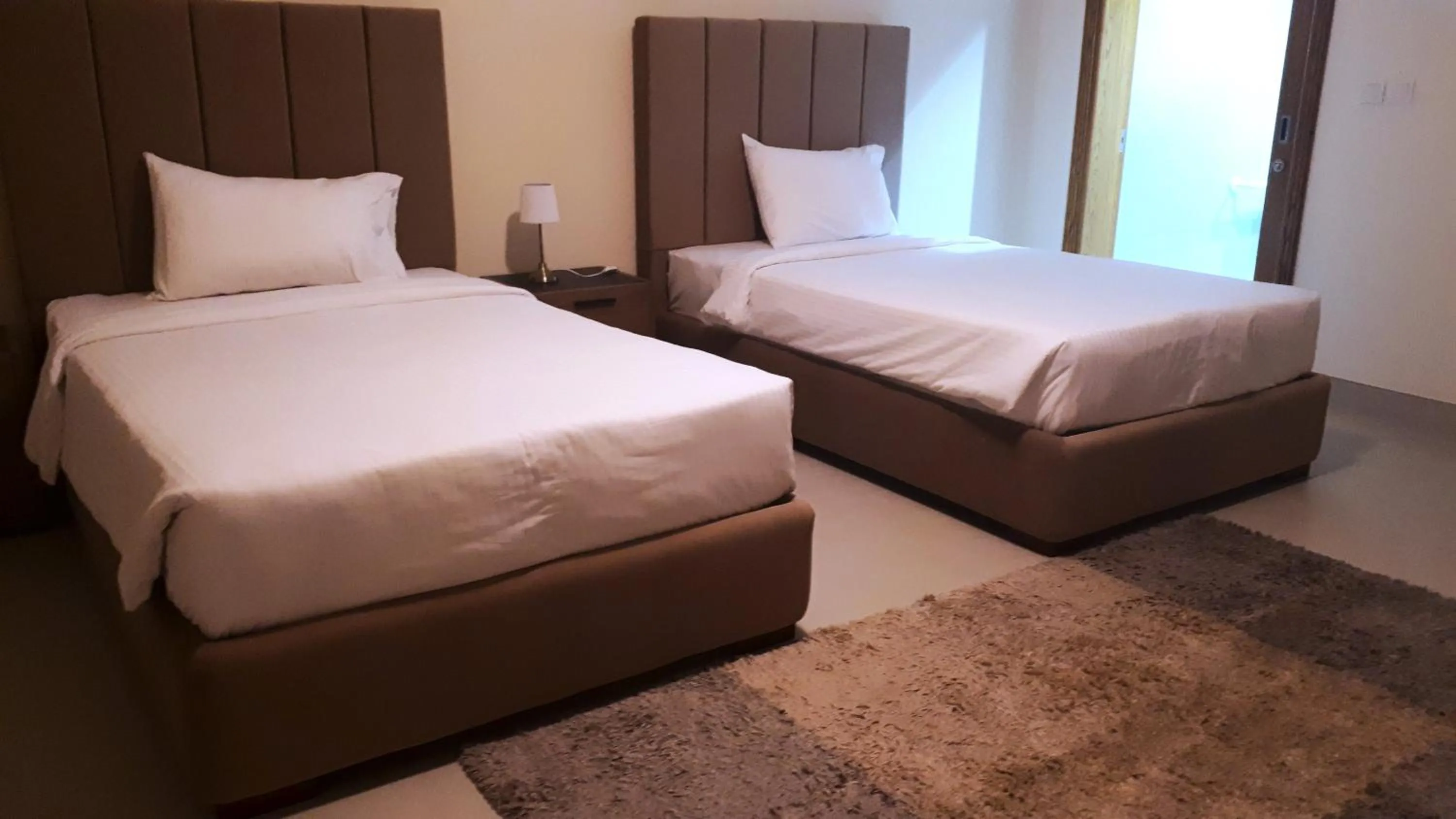 Bedroom in Magnum Hotel & Suites West Bay