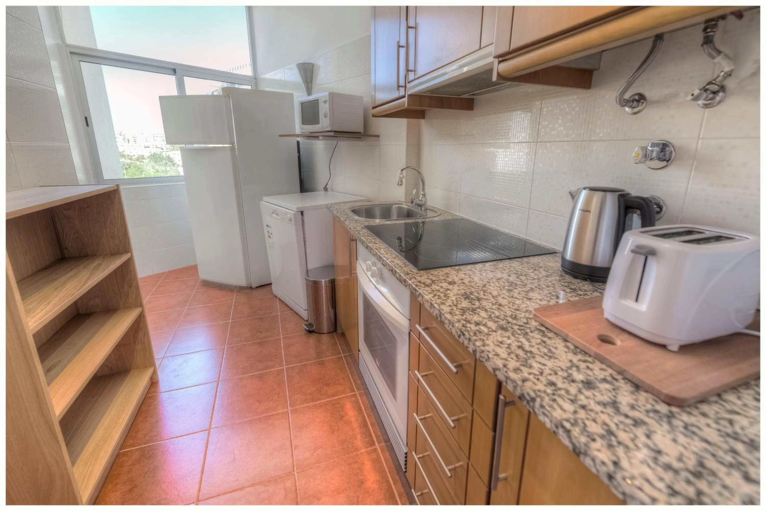 Communal kitchen in Apartamentos Belo Horizonte
