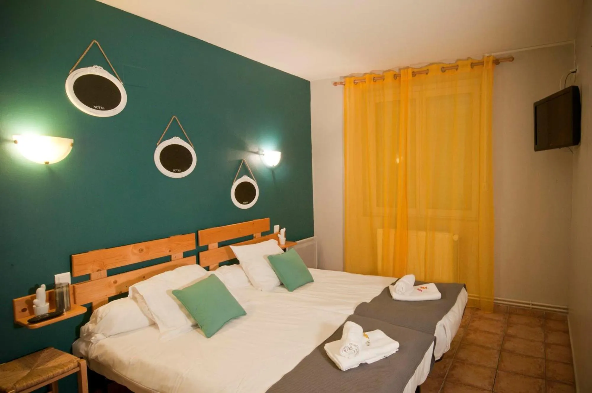 Bed in Logis hôtel restaurant Auberge de l'Espinouse