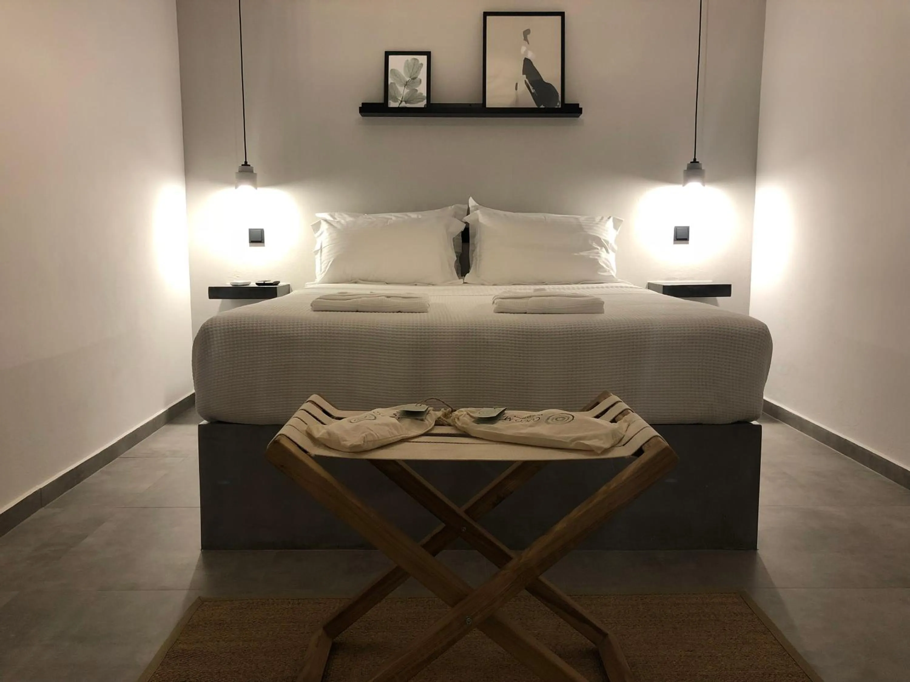 Bed in Calme Suites Mani